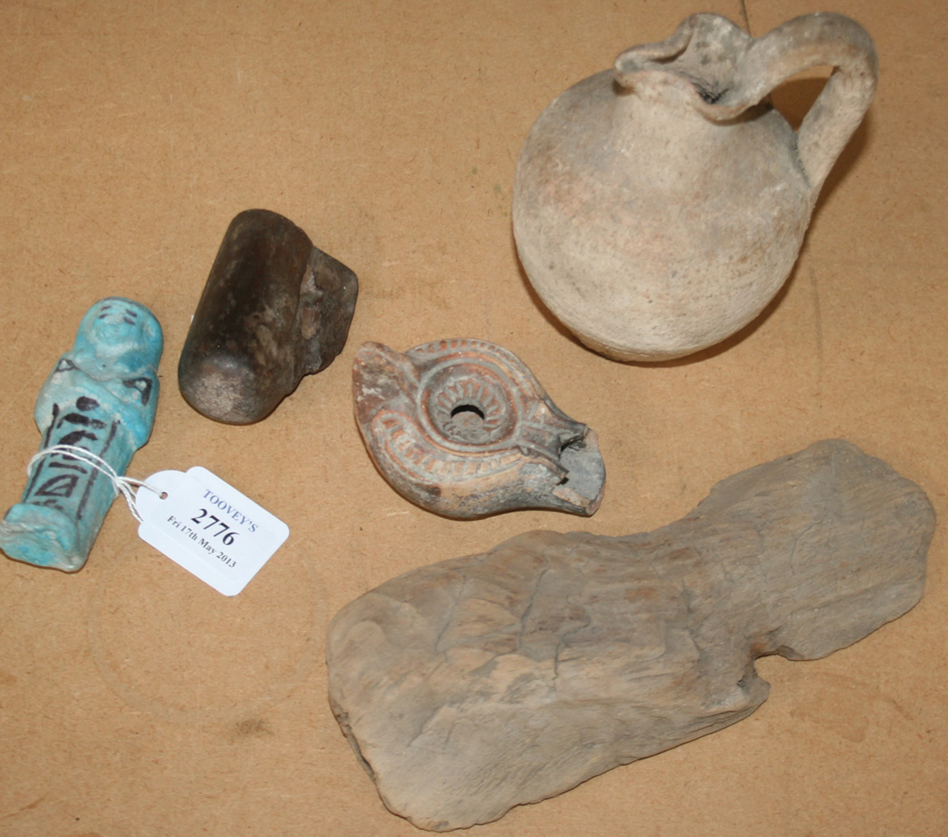 AN EGYPTIAN TURQUOISE GLAZED FAIENCE SHABTI WITH PAINTED HIEROGLYPHICS