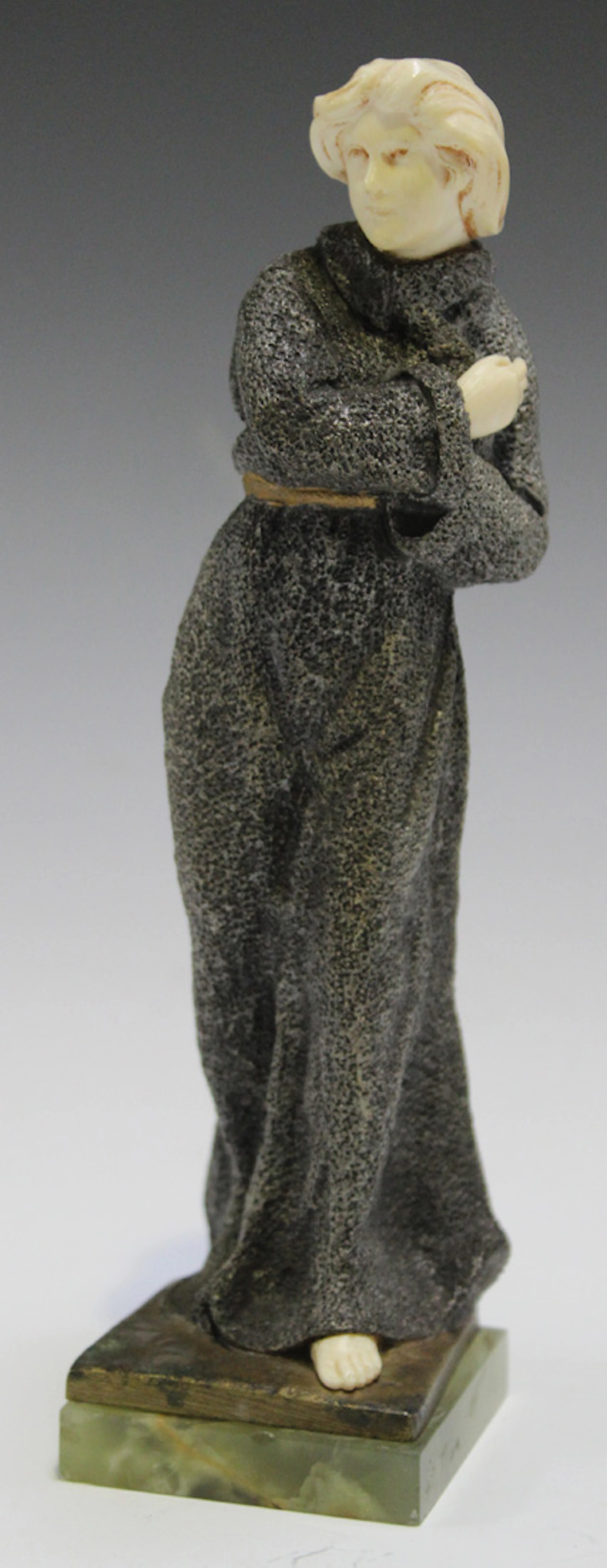 AN EARLY 20TH CENTURY CAST BRONZE AND CARVED IVORY FULL-LENGTH FIGURE