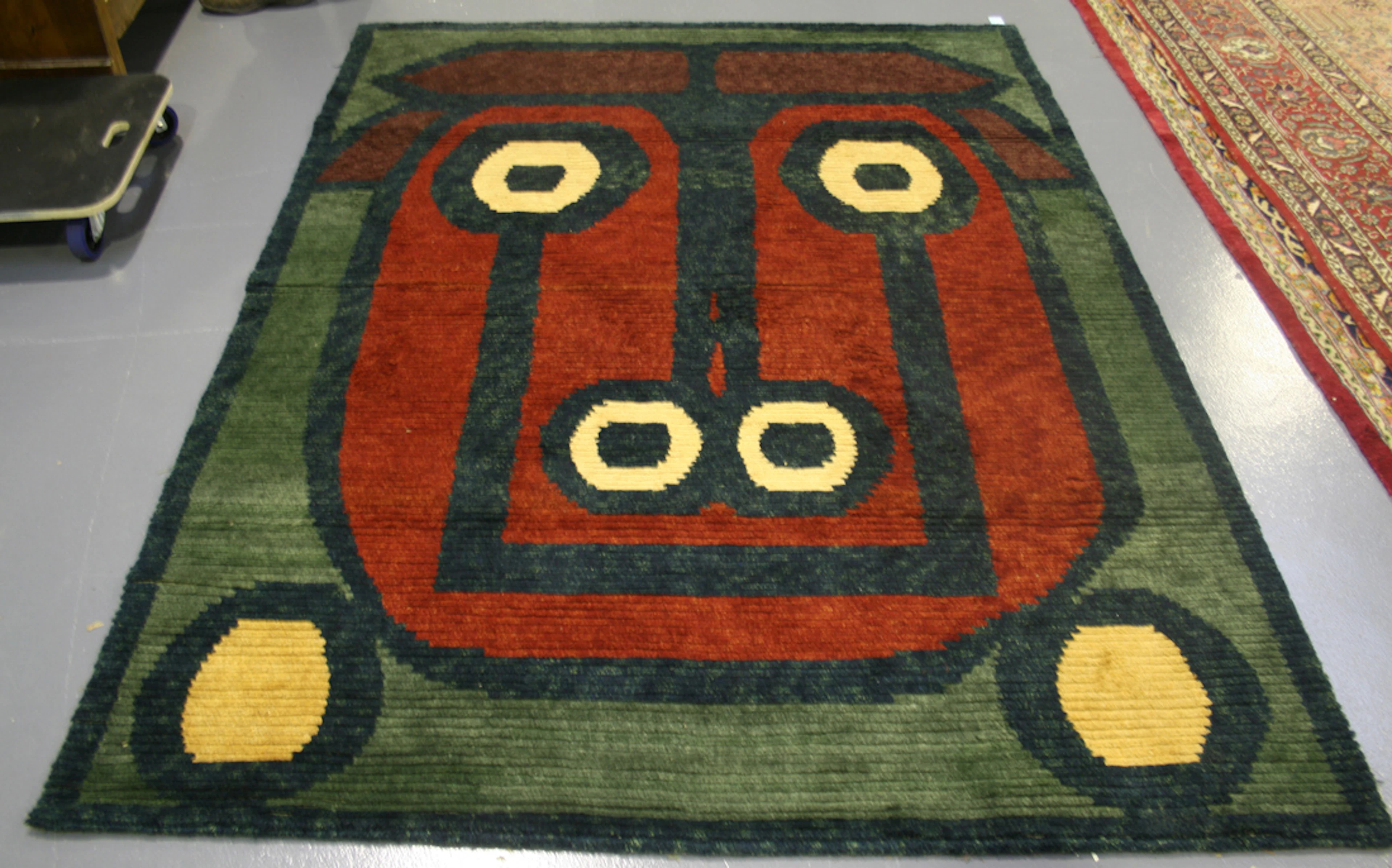 A NEPALESE 'MUCCA' DESIGN RUG