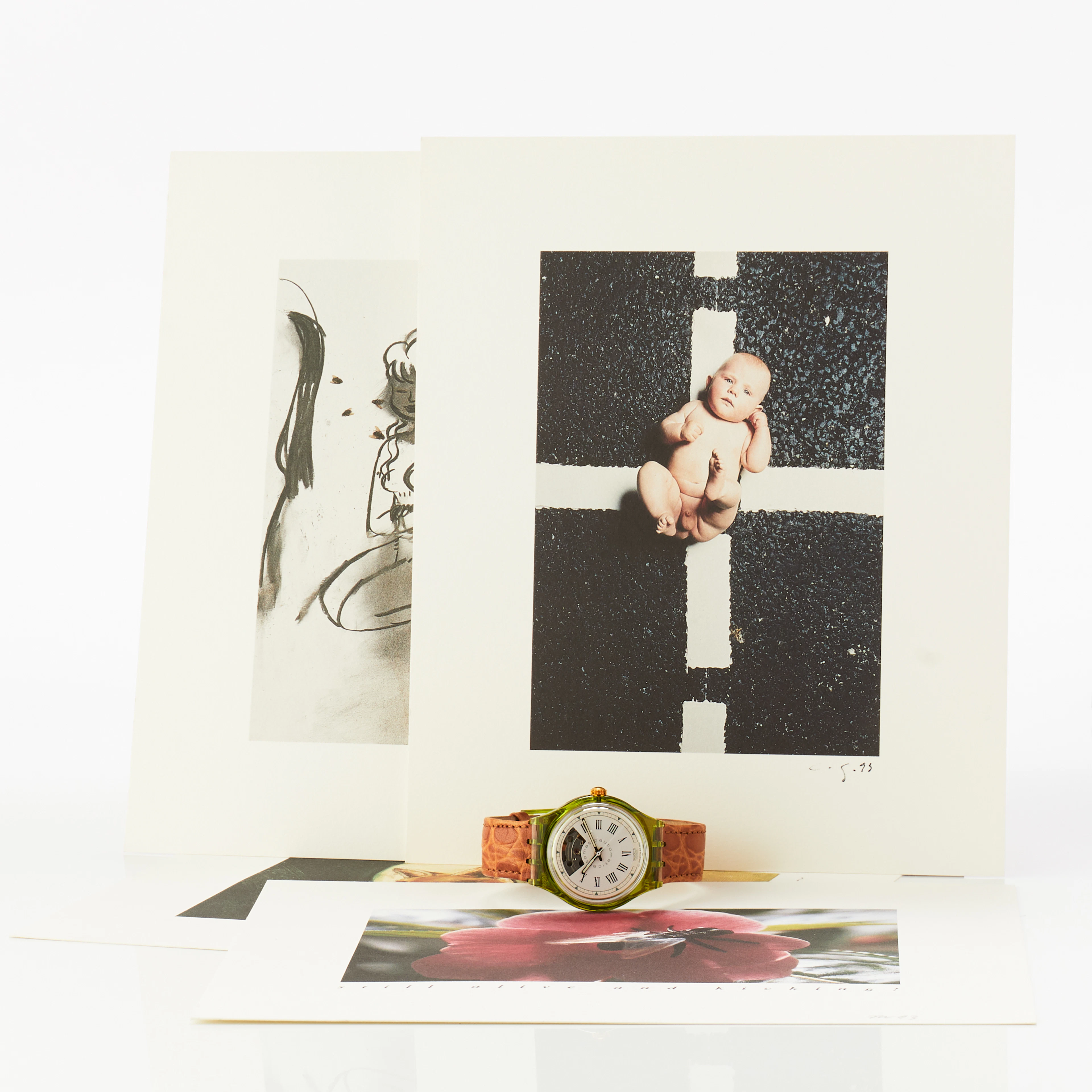 Swatch armbandsur samt fem grafiska blad