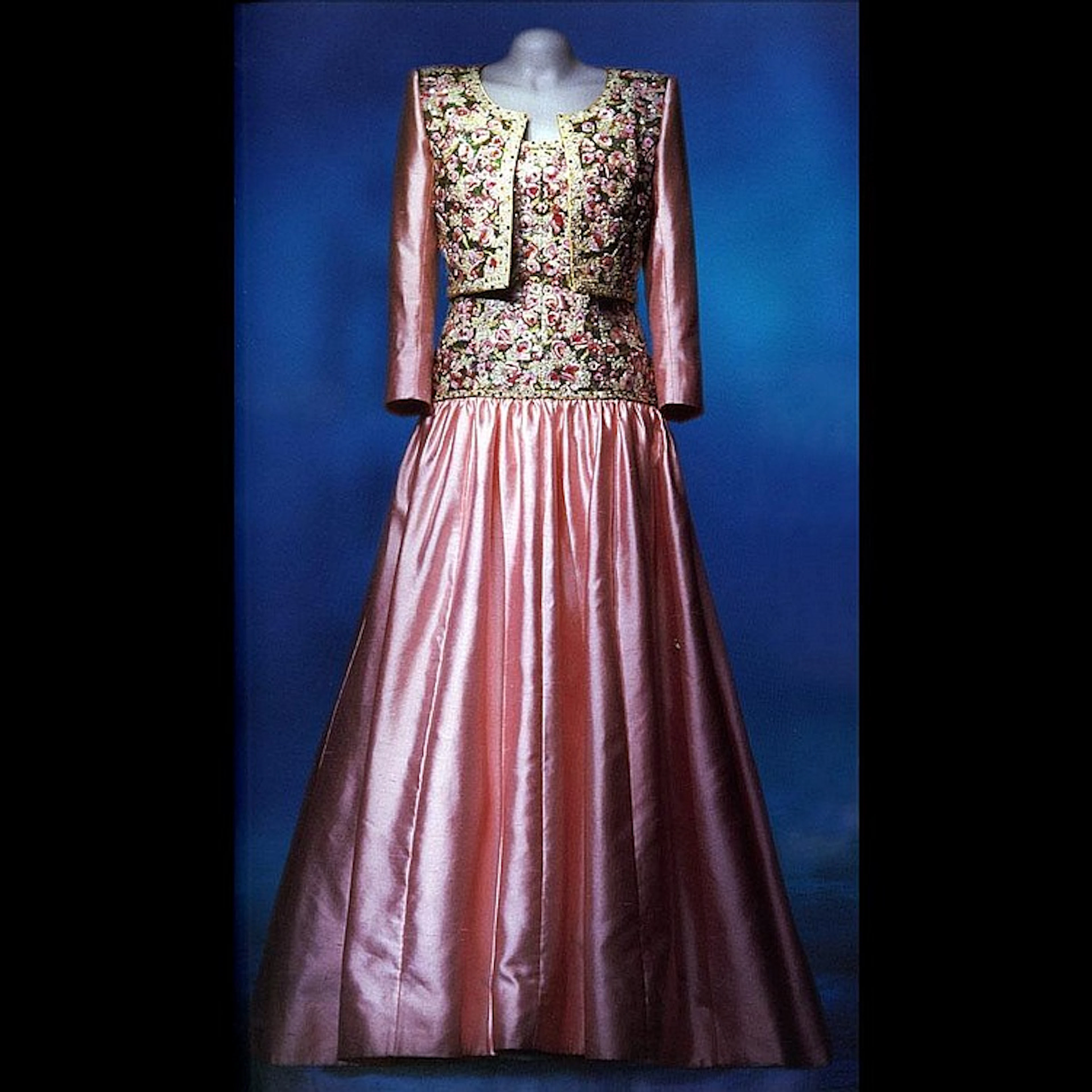 A long evening dress of lilac wild silk, with an embroidered bolero