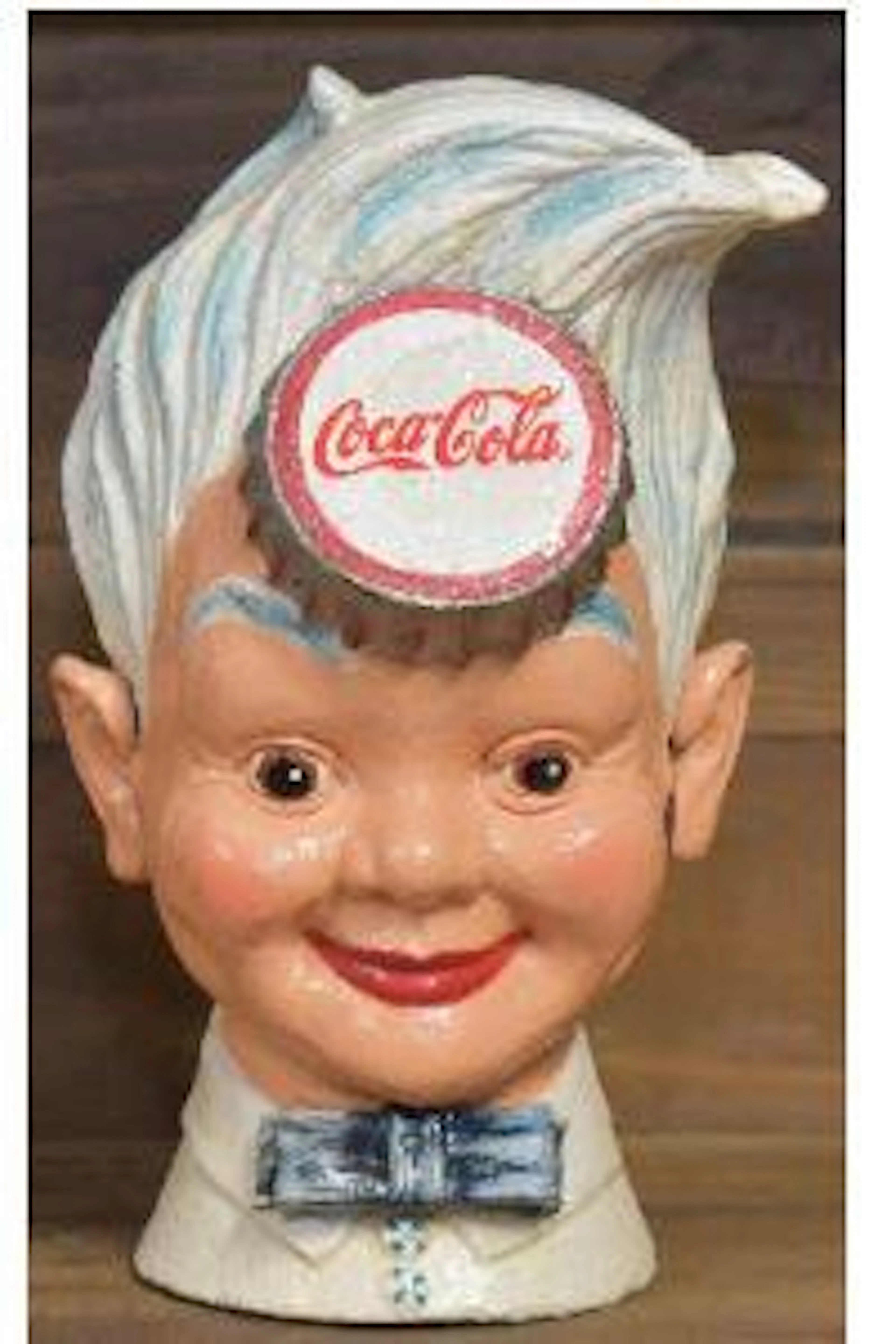 Cast iron coca-cola sprite boy bank