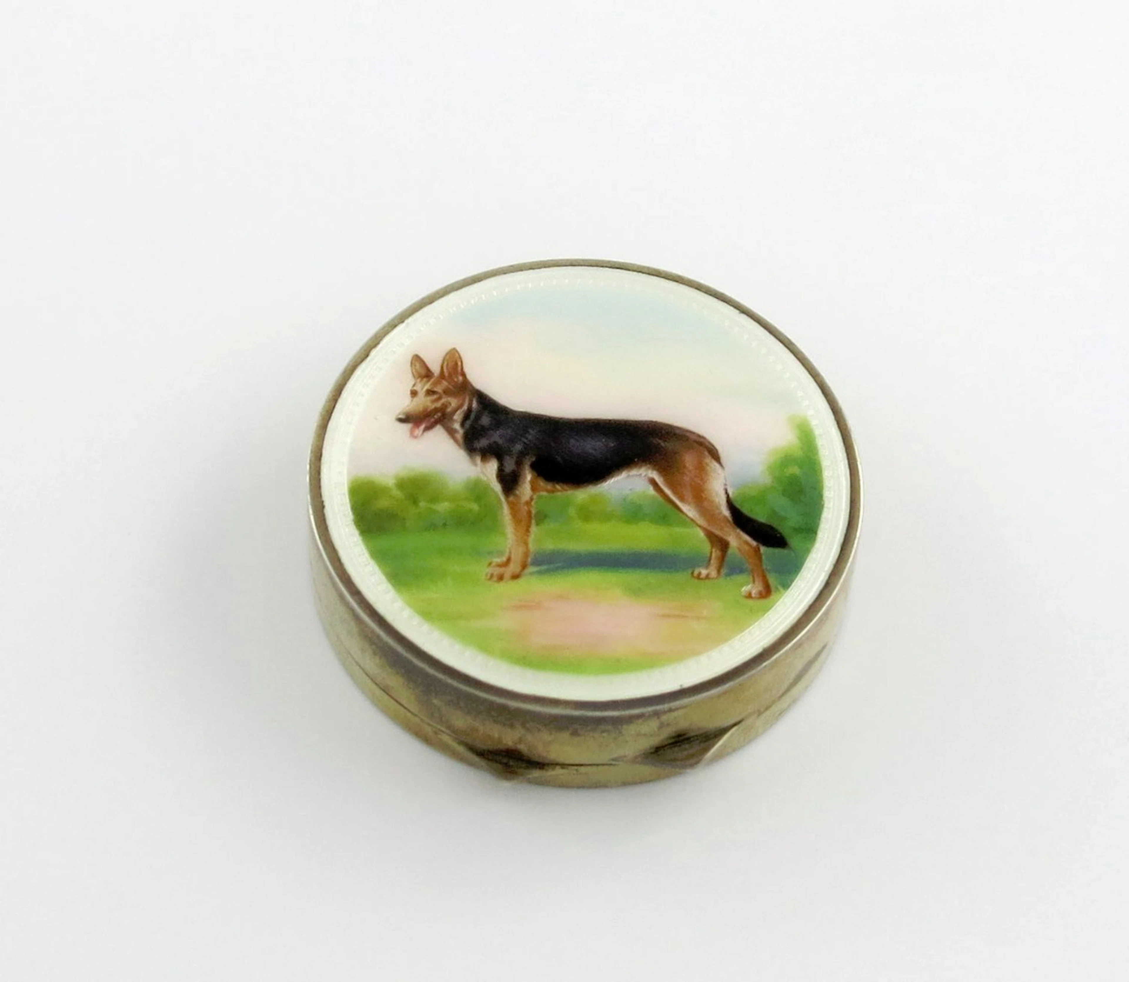 A French silver-gilt and enamel compact