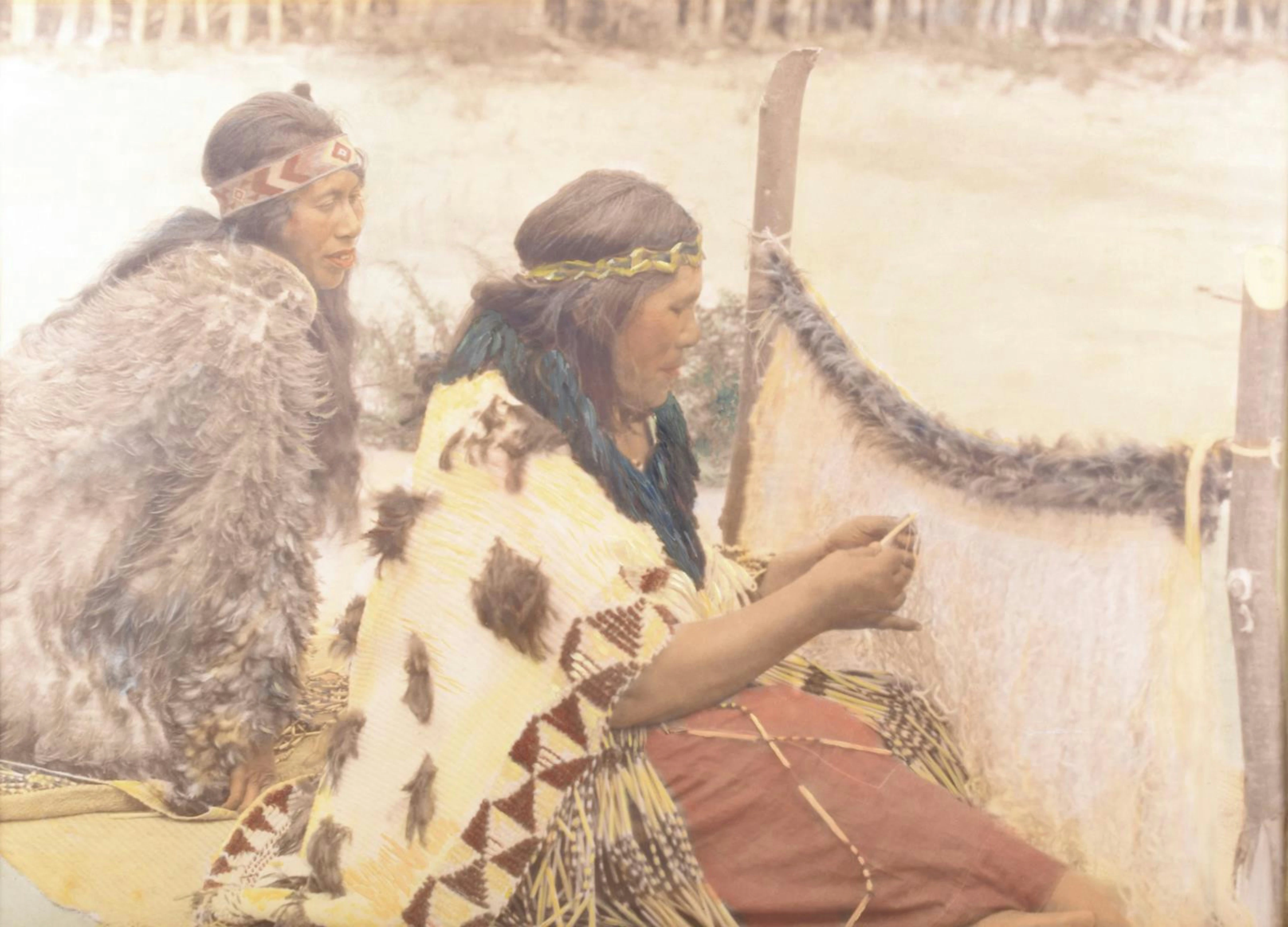 A large hand coloured photographic print of Maori weavers