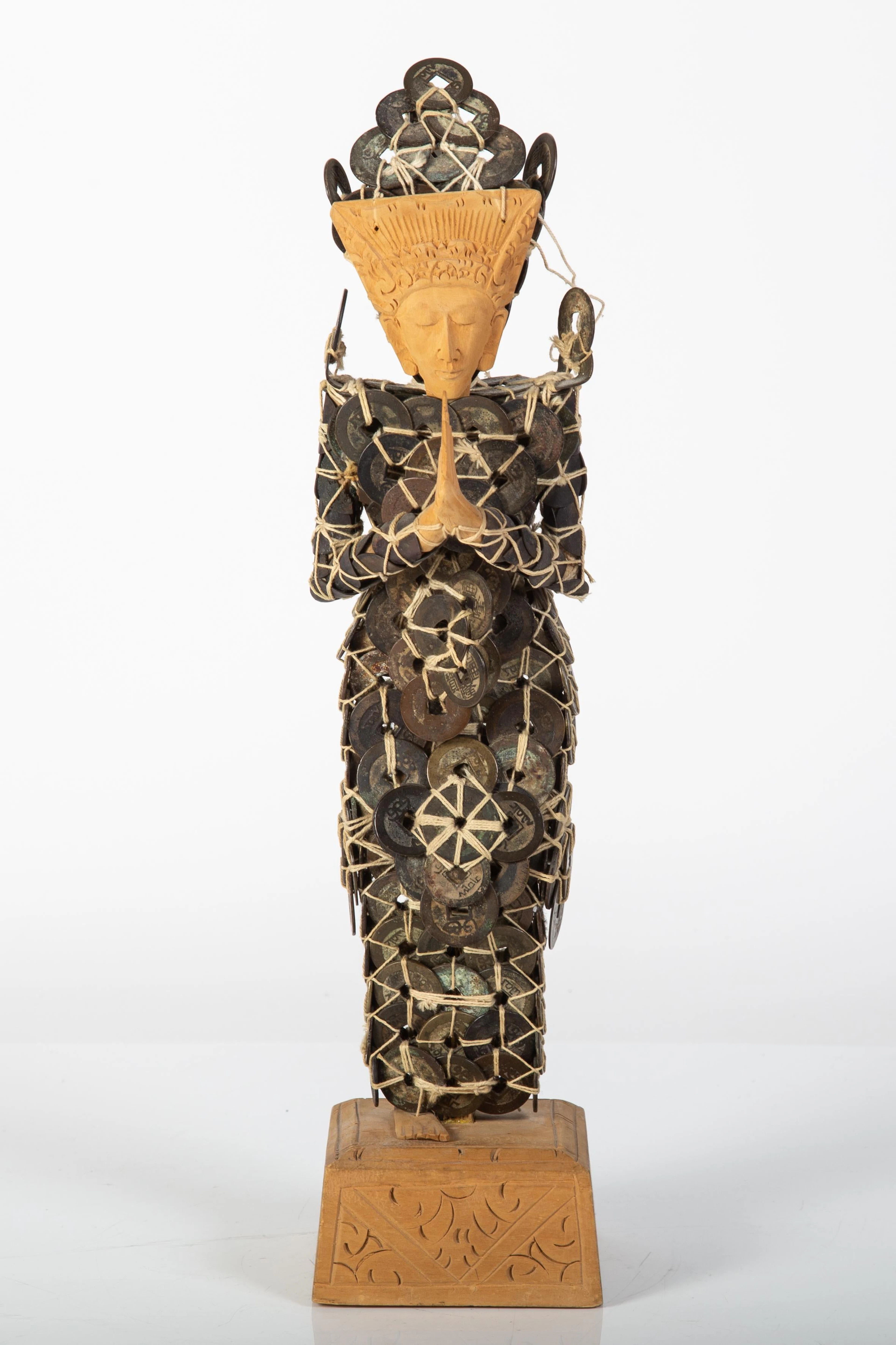 ASIAN COIN-ORNAMENTED FIGURE