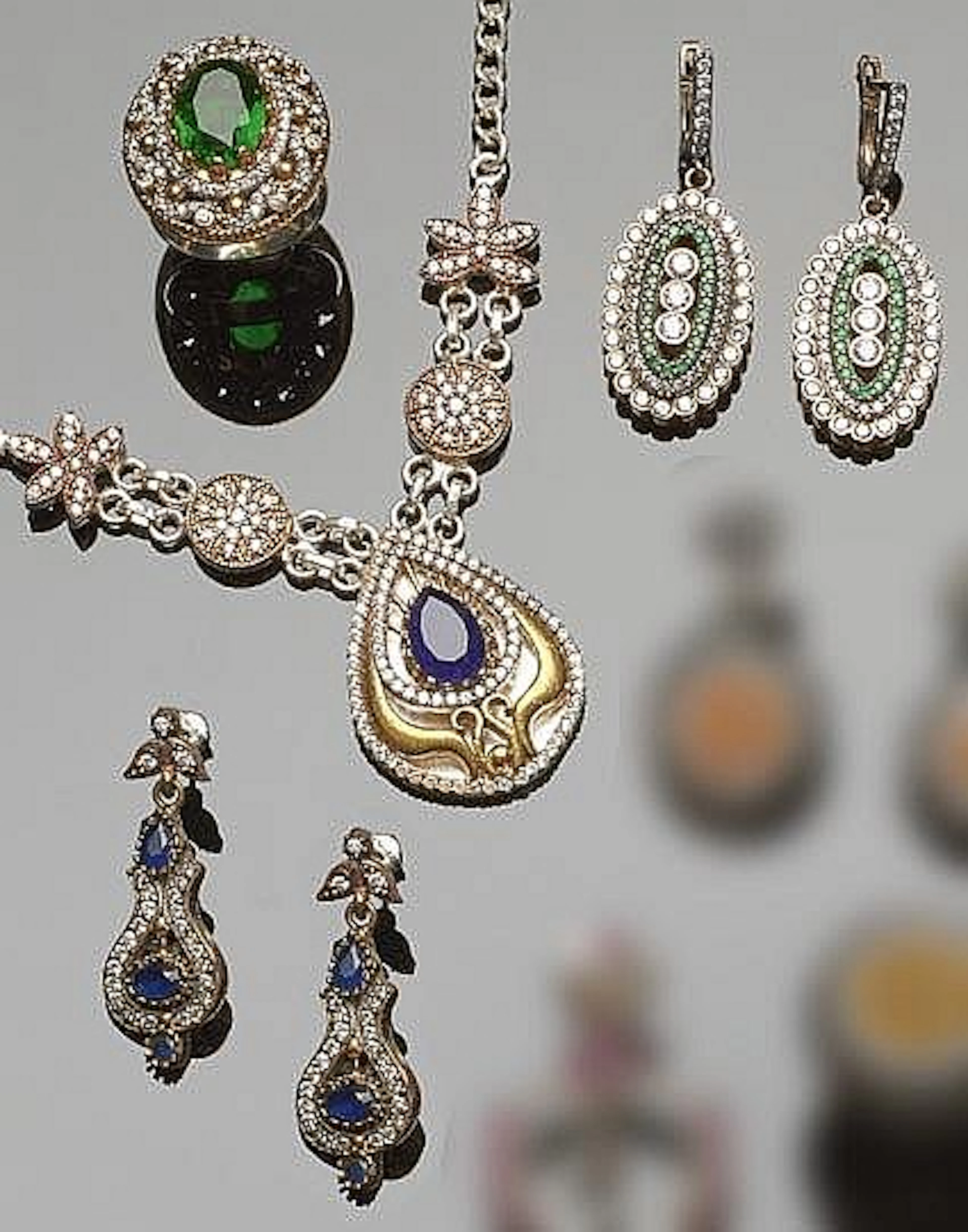 A SET OF SILVER, BRONZE, MULTI-COLORED GEMSTONE AND ZIRCON JEWELRY