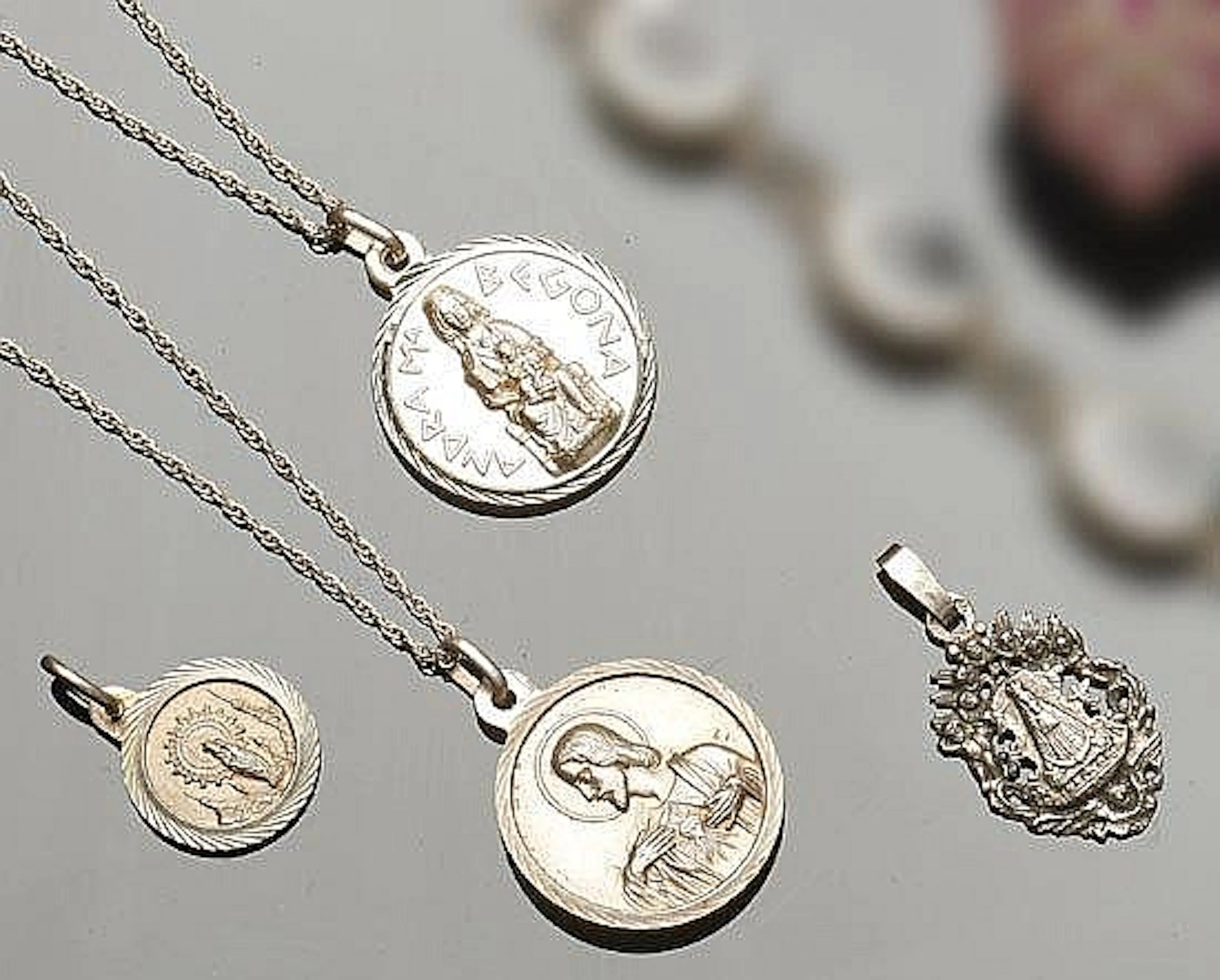 A SET OF FOUR VINTAGE SILVER MEDALS