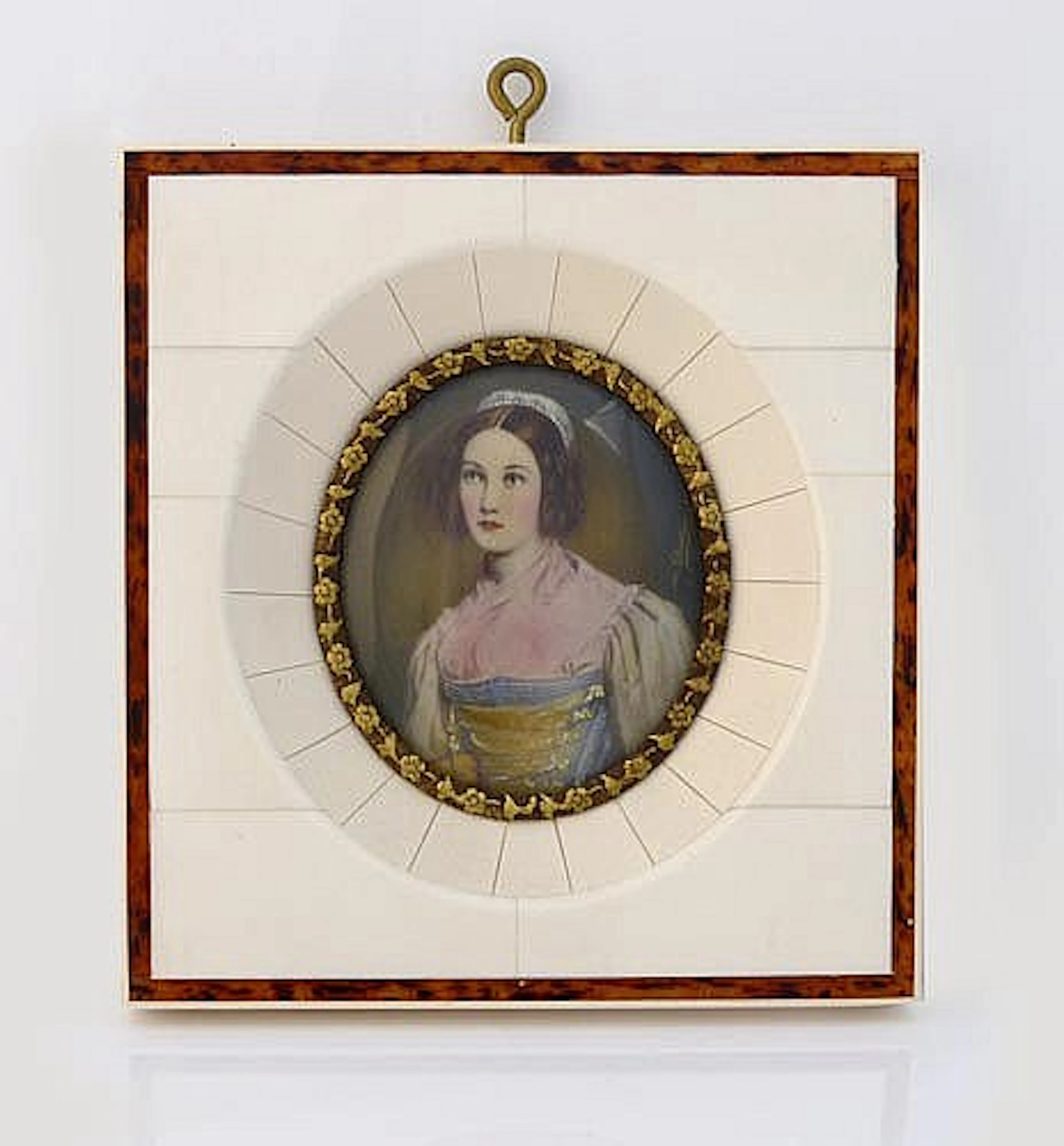 A MINIATURE IVORY PORTRAIT