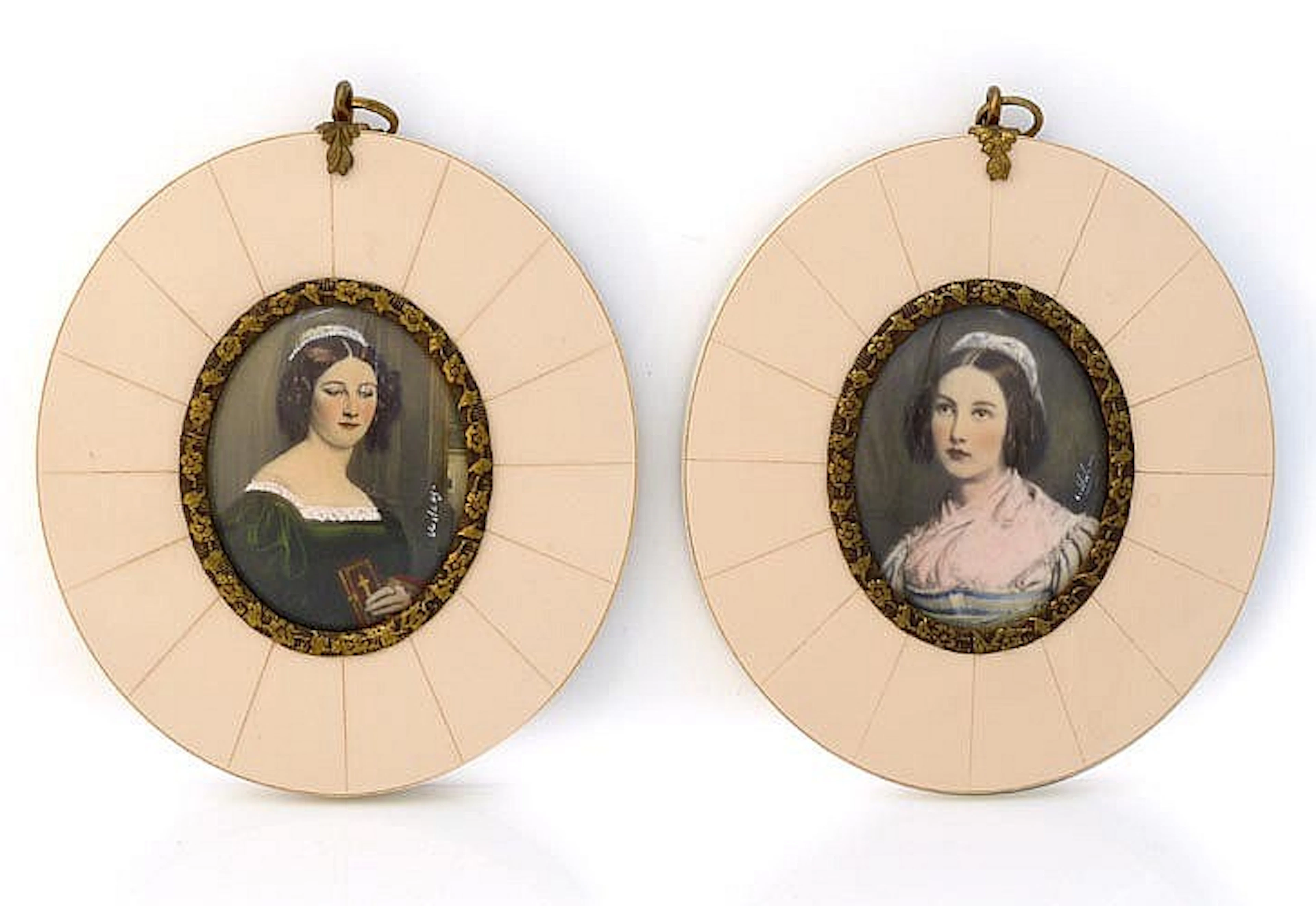 A PAIR OF MINIATURE IVORY PORTRAITS