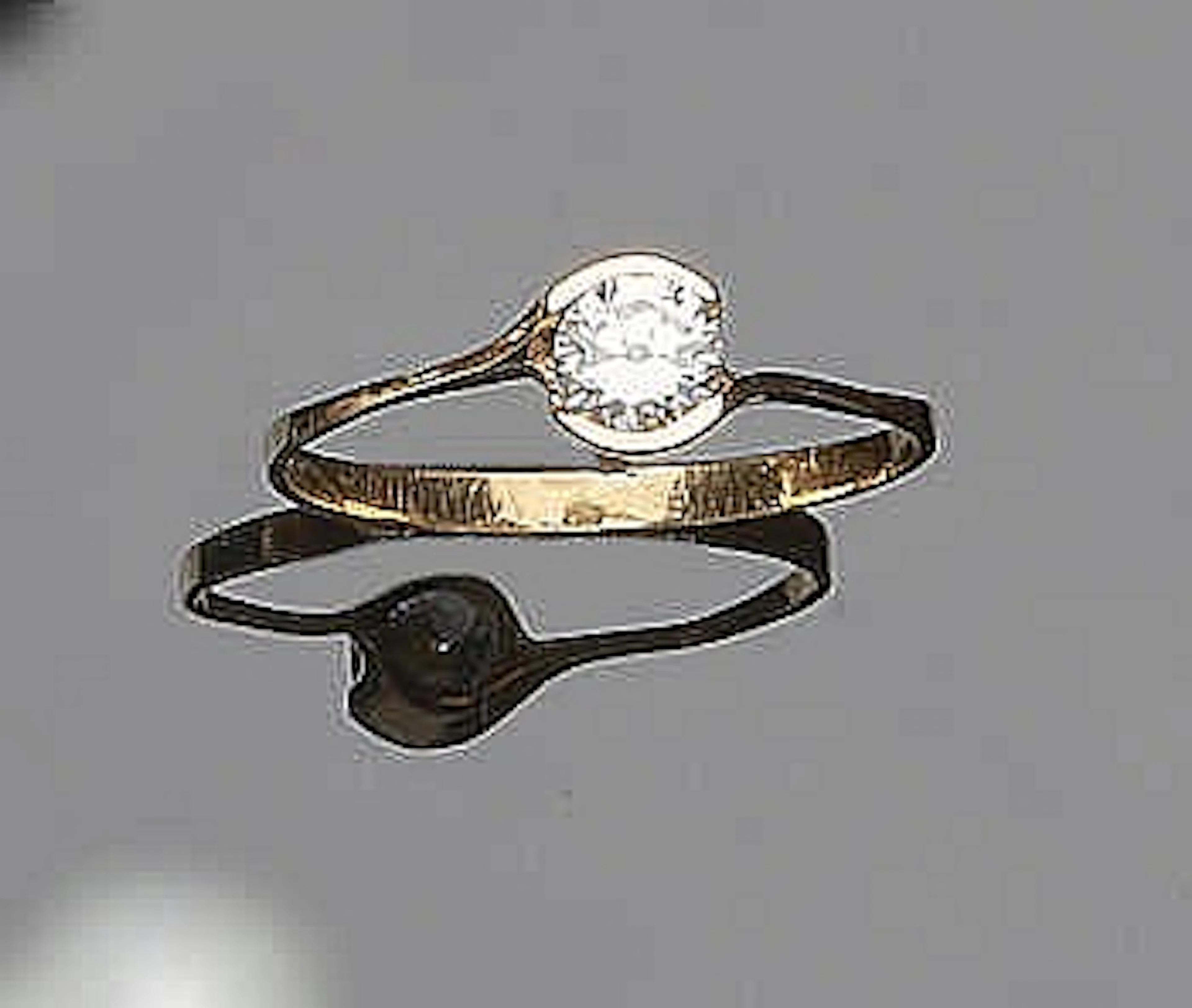 A GOLD AND ZIRCON RING