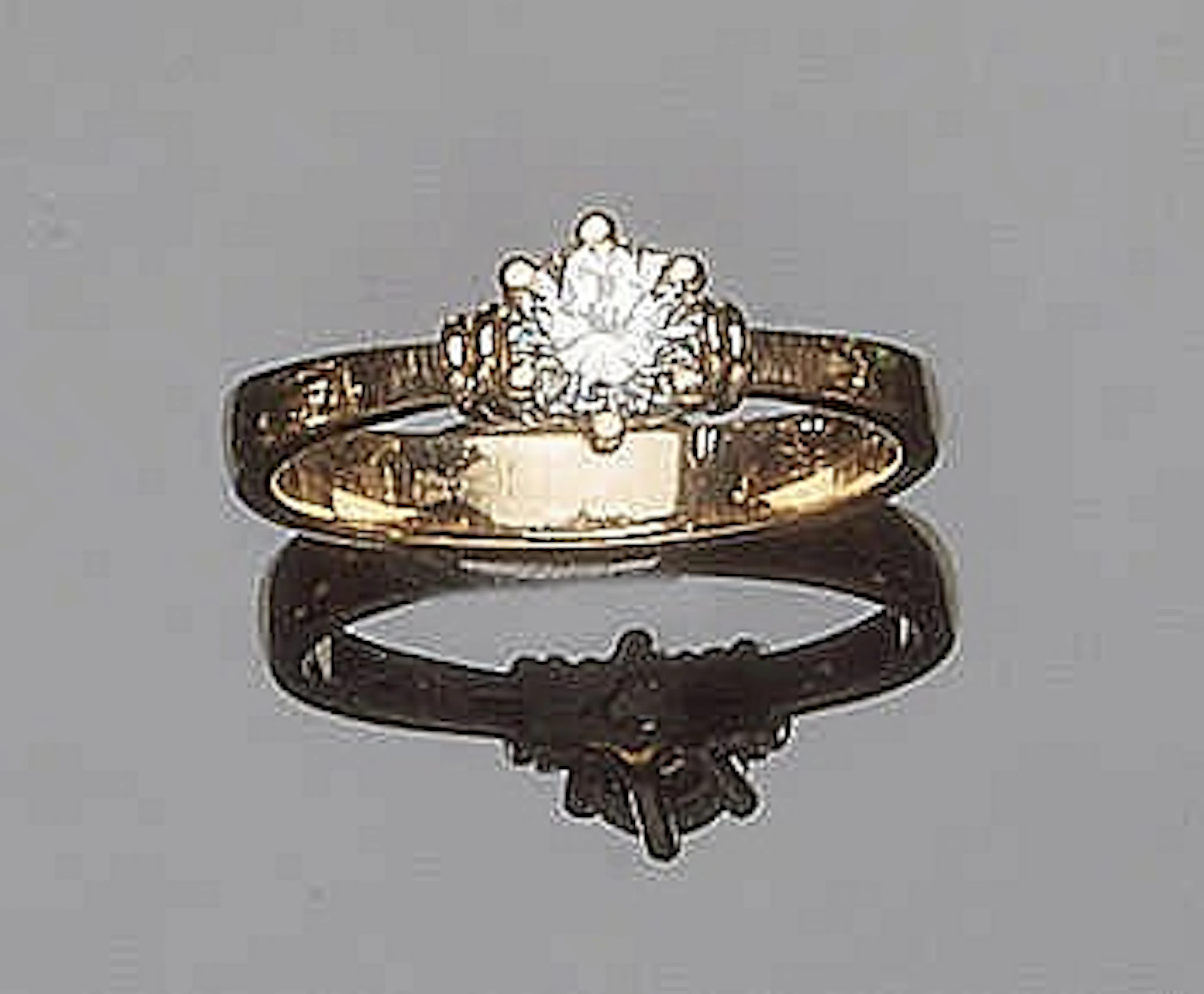 A GOLD AND DIAMOND RING