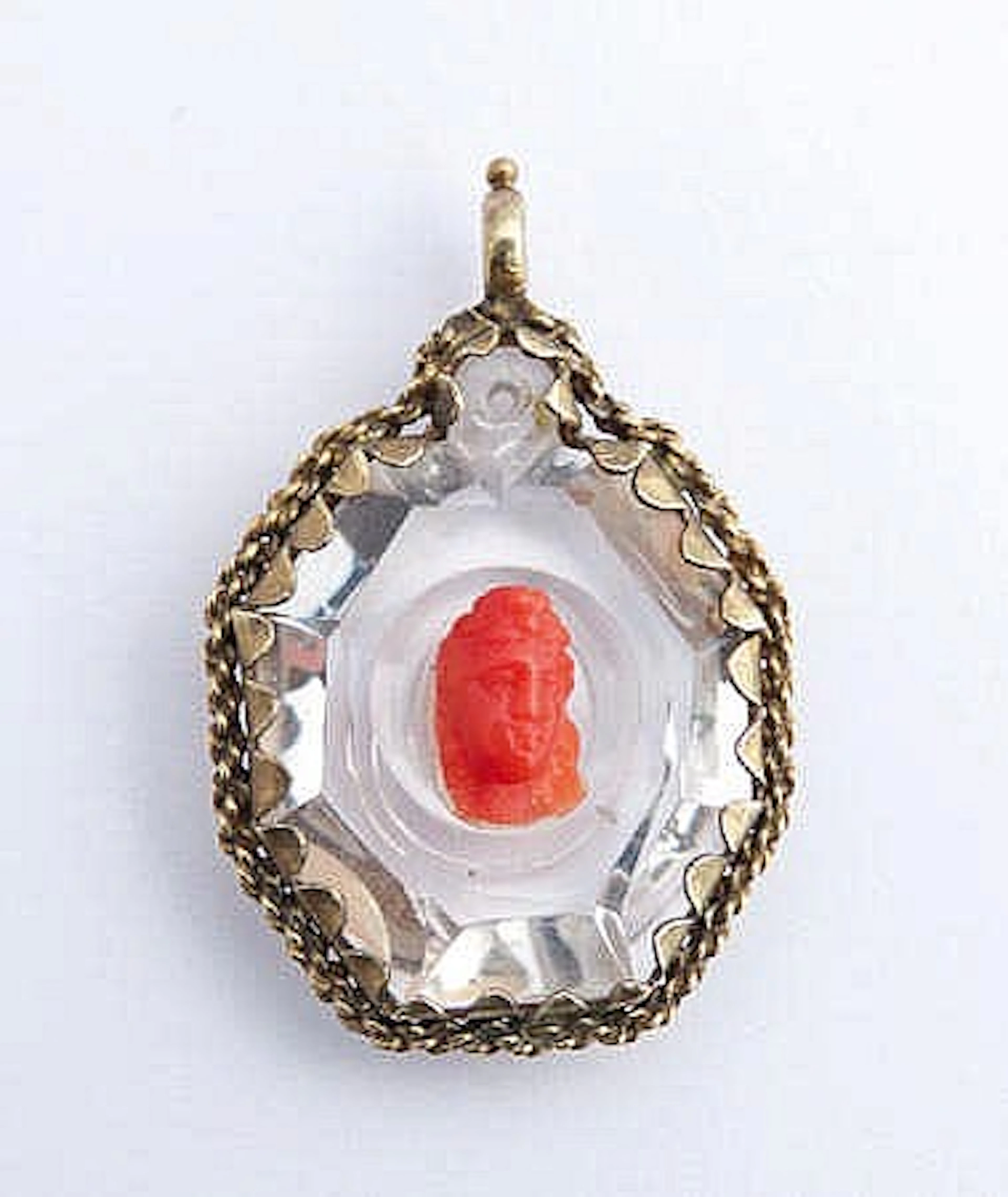 A GOLD AND ROCK CRYSTAL PENDANT