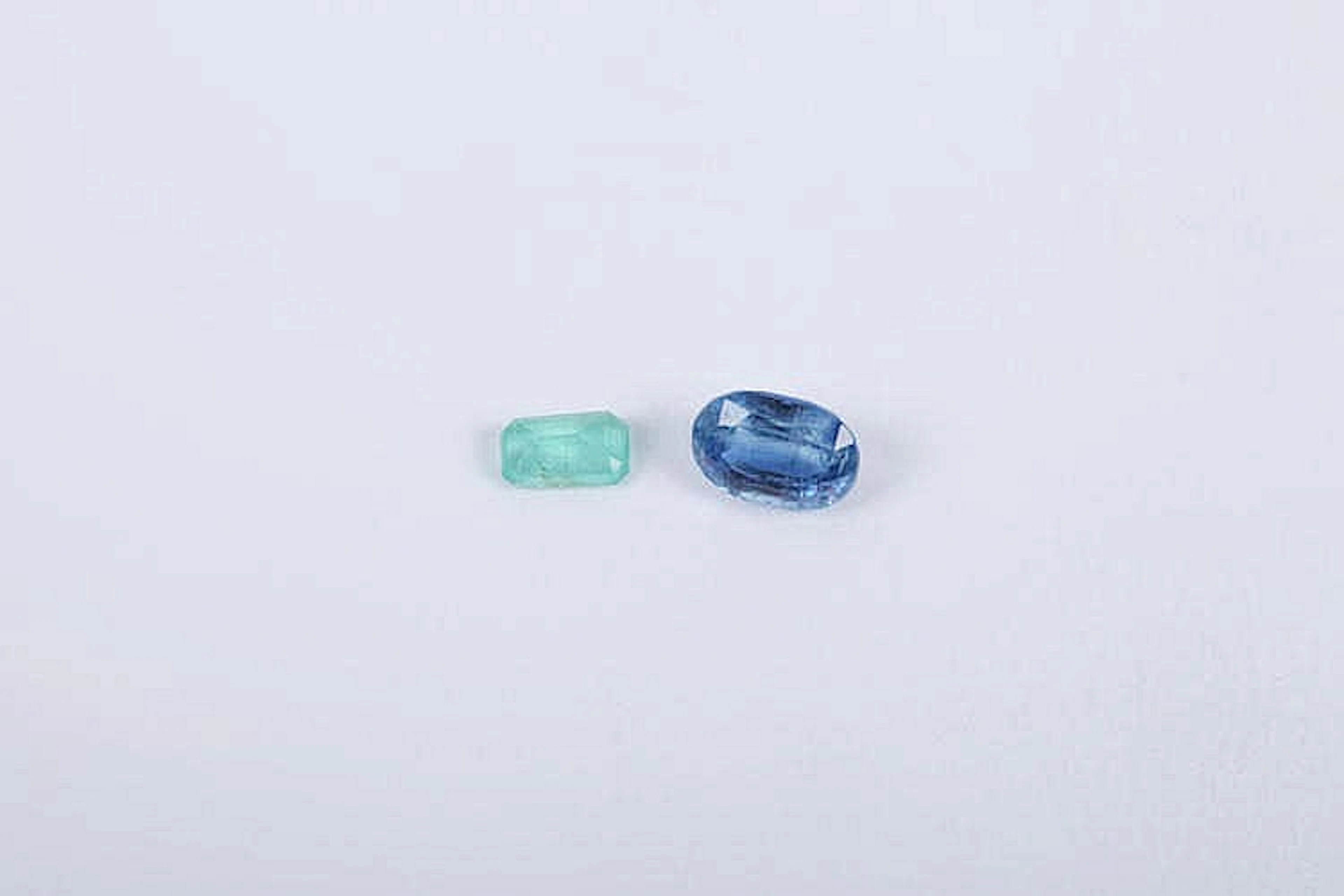 AN EMERALD AND IOLITE GEMSTONES