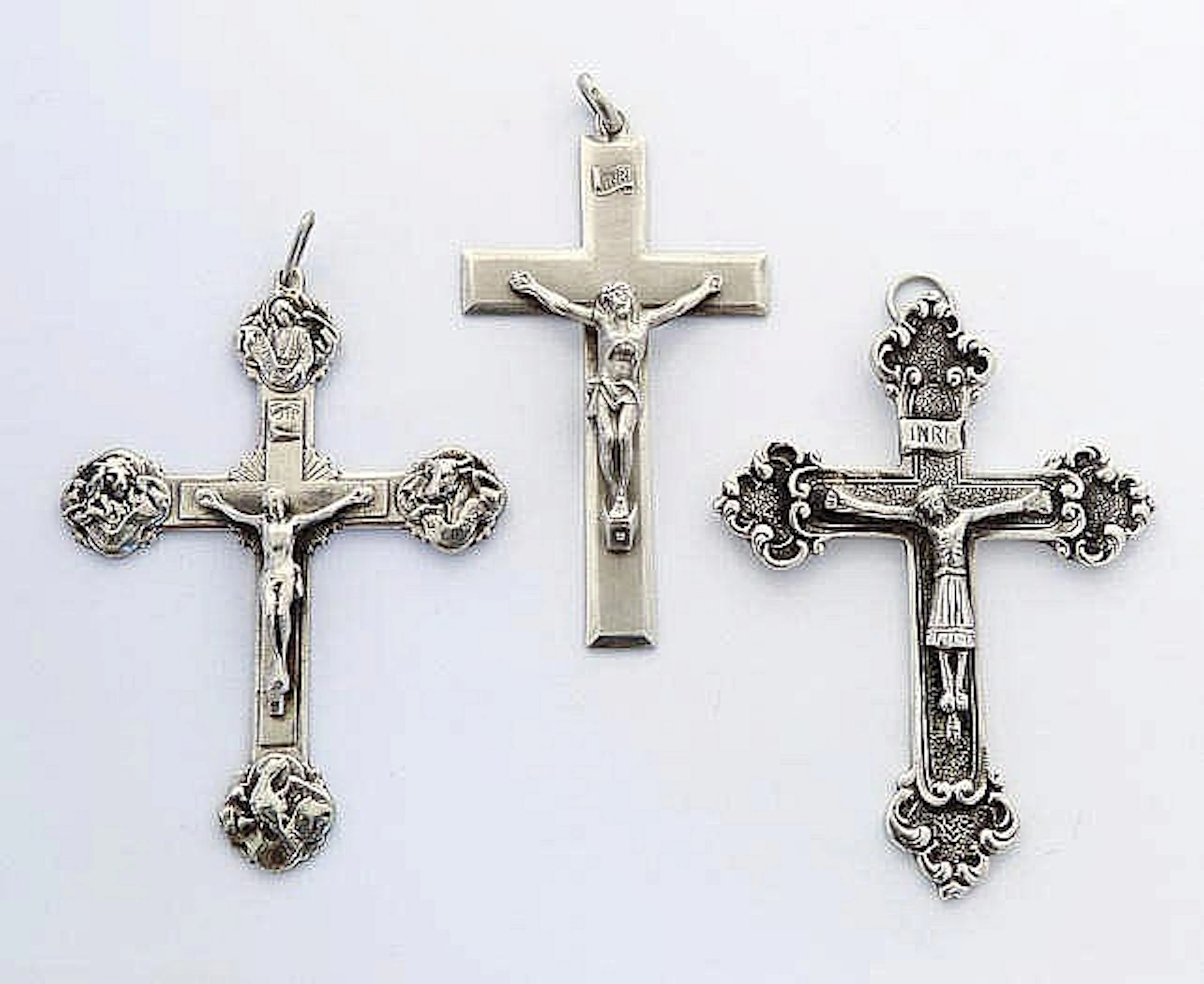 THREE VINTAGE CROSS PENDANTS
