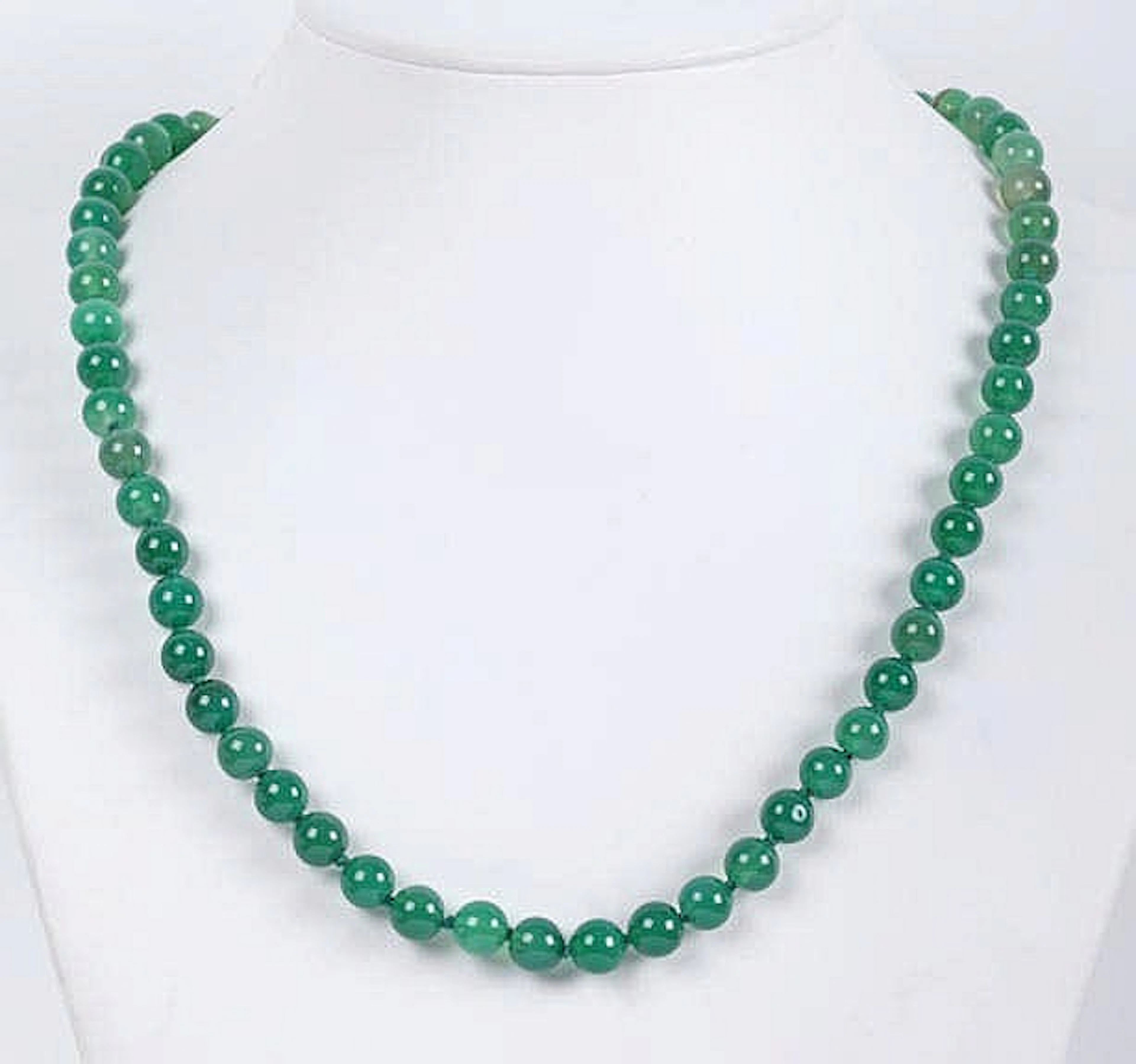 A GREEN JADE BEAD NECKLACE