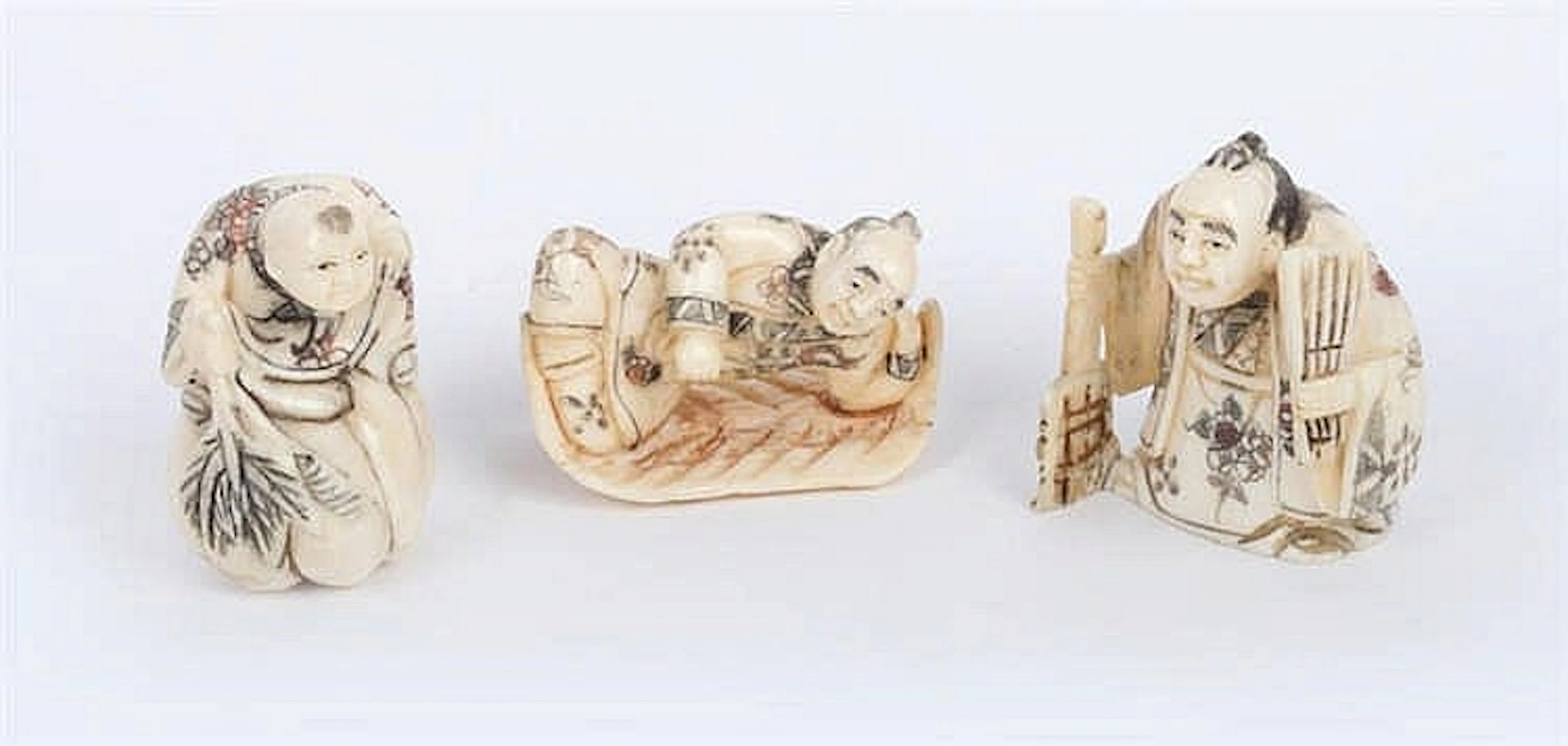A GROUP OF THREE VINTAGE IVORY NETSUKES