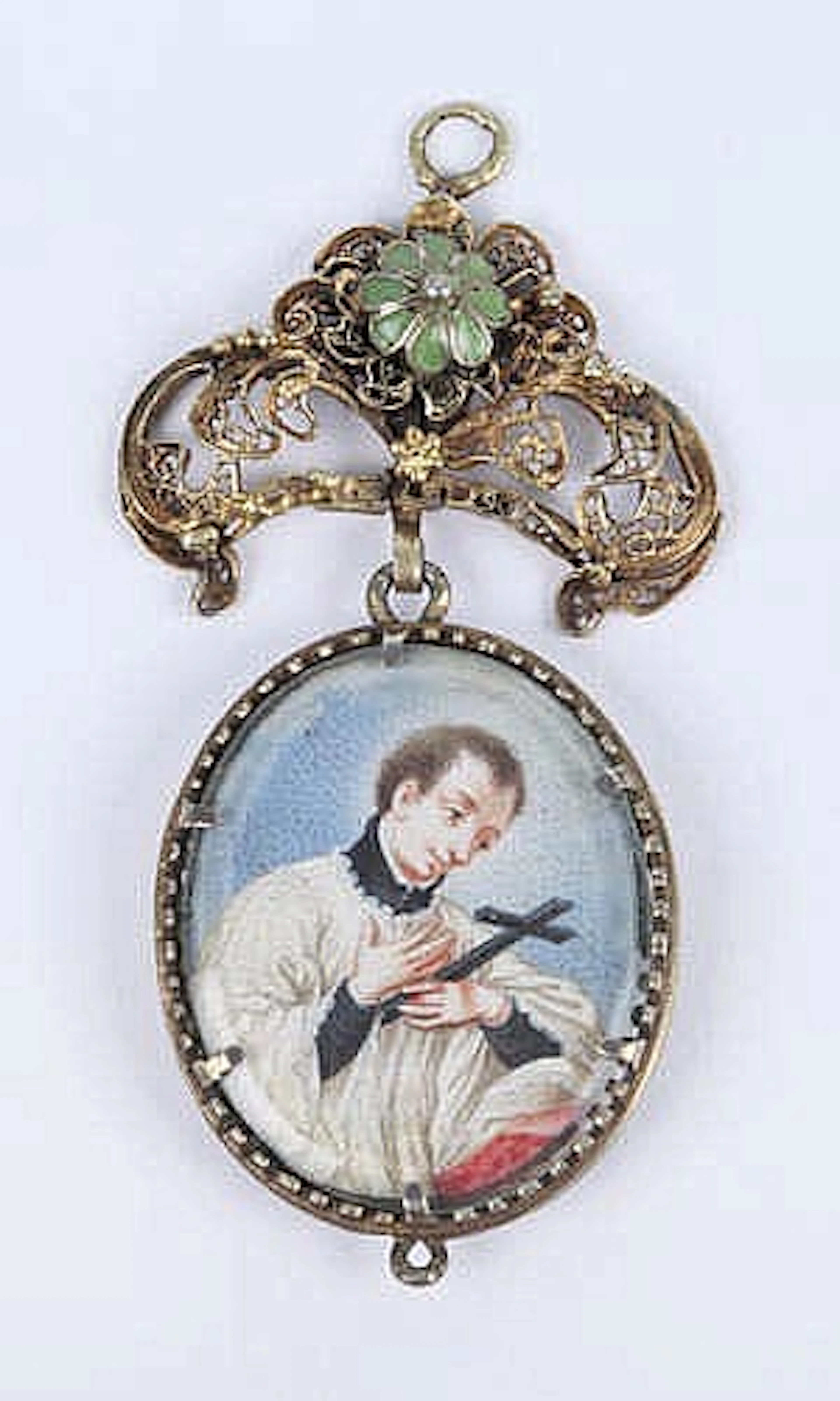 A GOLD AND ENAMEL MINIATURE PORTRAIT BROOCH