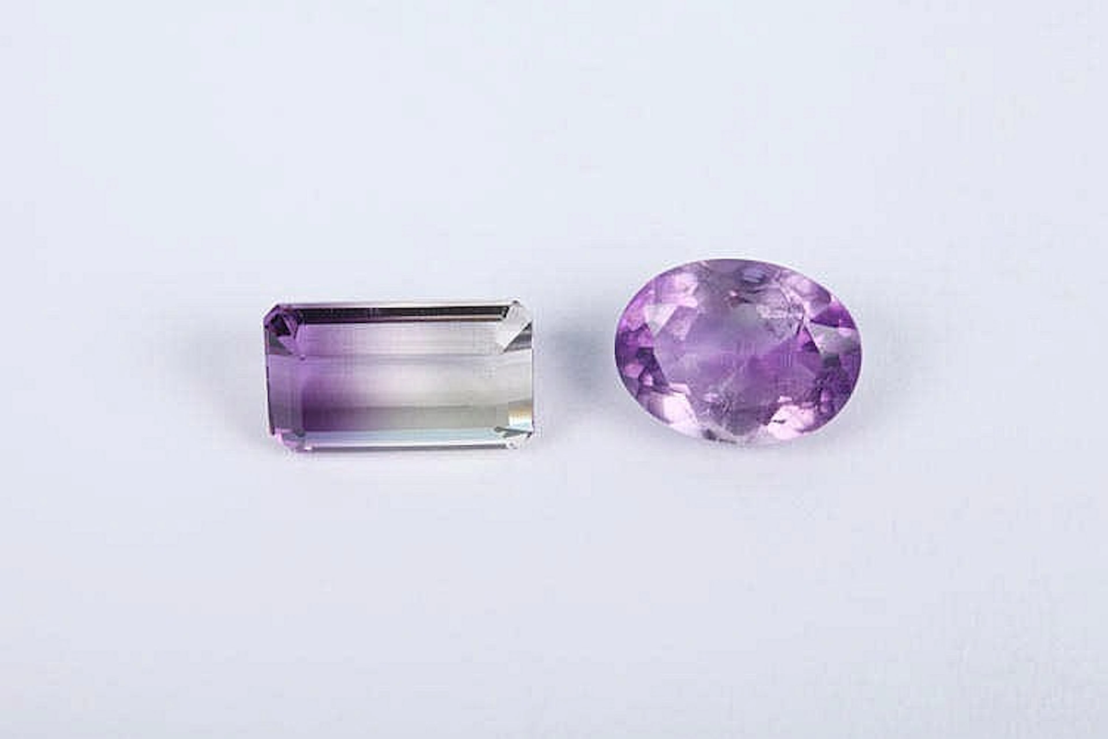 AN AMETRINE AND AMETHYST GEMSTONES