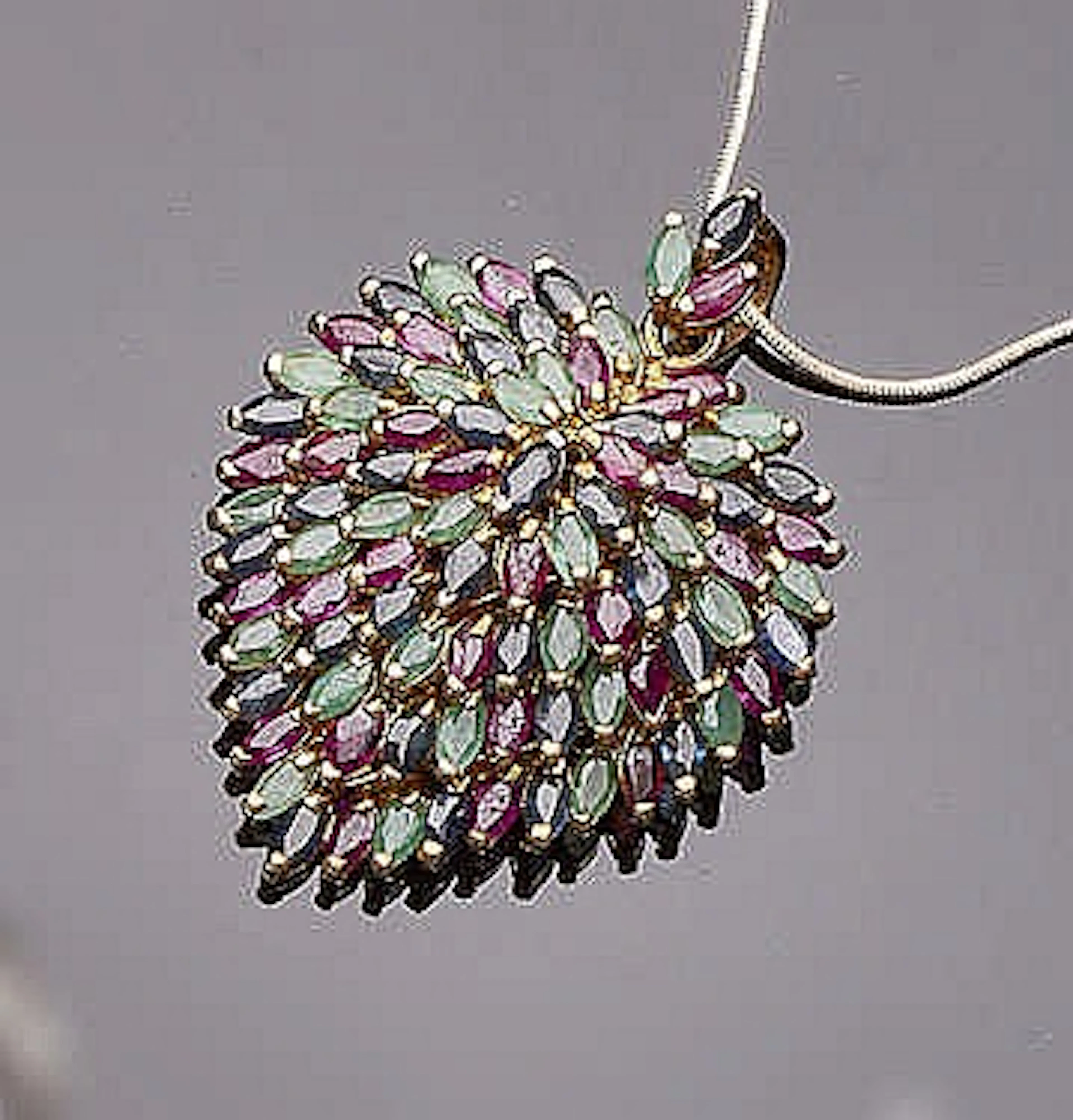 A RUBY, SAPPHIRE AND EMERALD PENDANT NECKLACE
