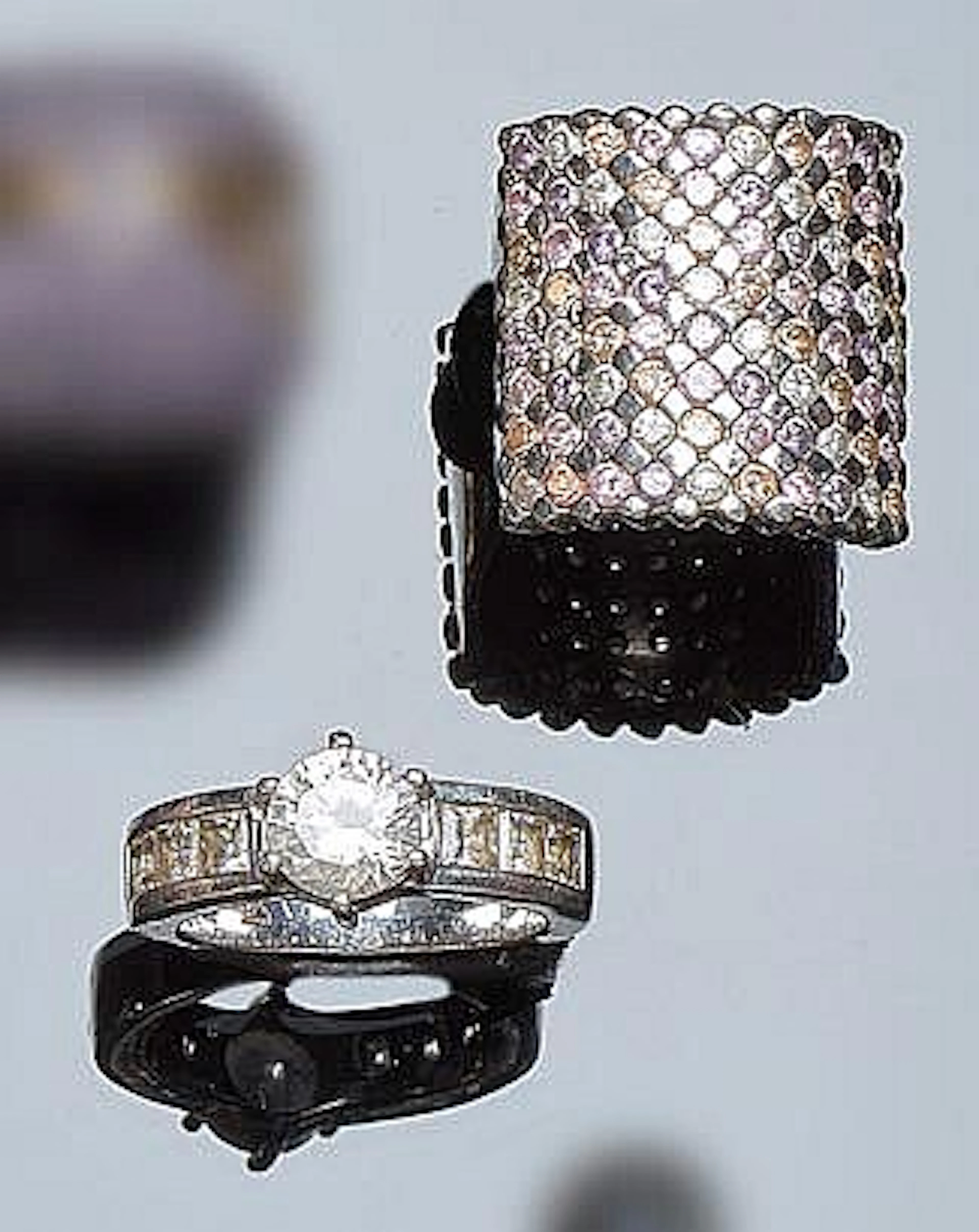 A PAIR OF SILVER AND ZIRCON RINGS