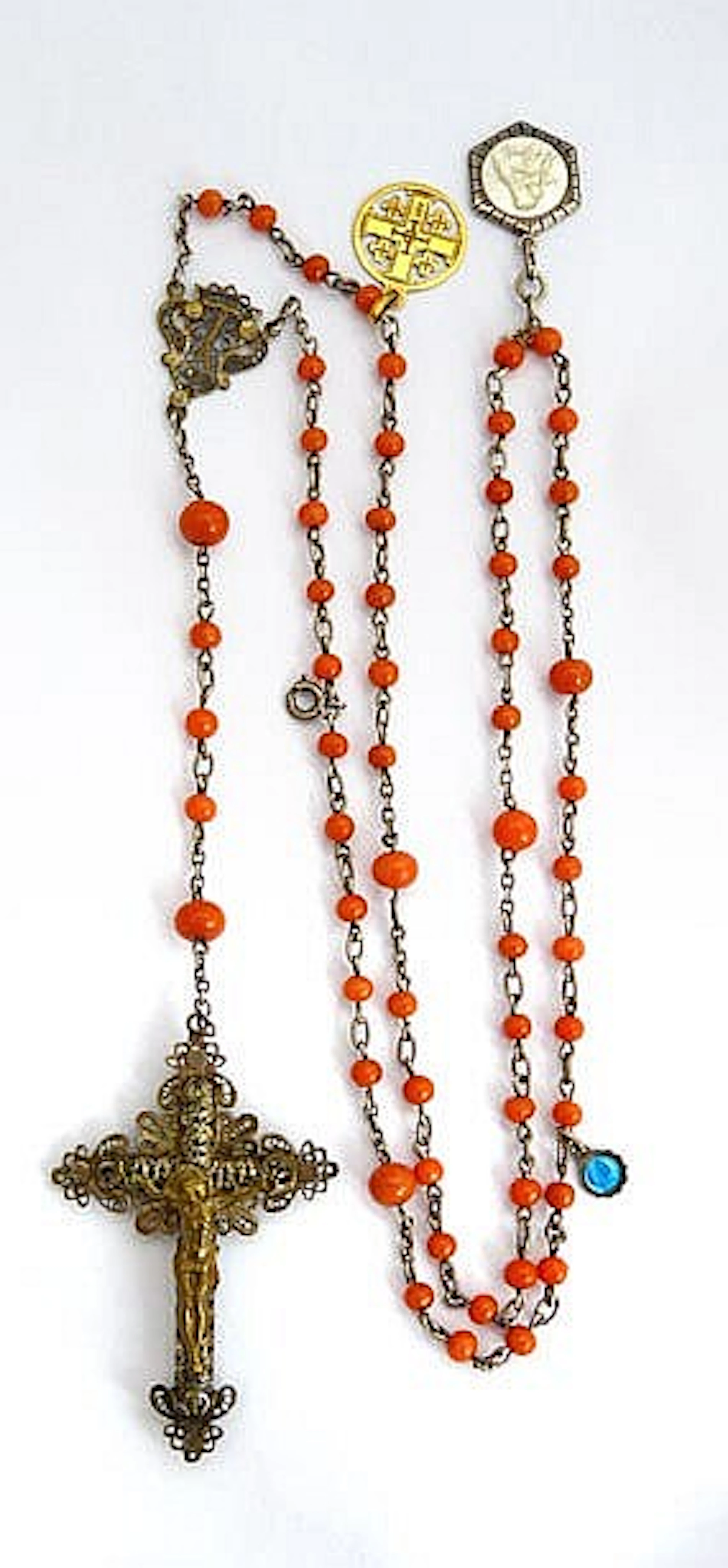 A VINTAGE SILVER AND CORAL ROSARY