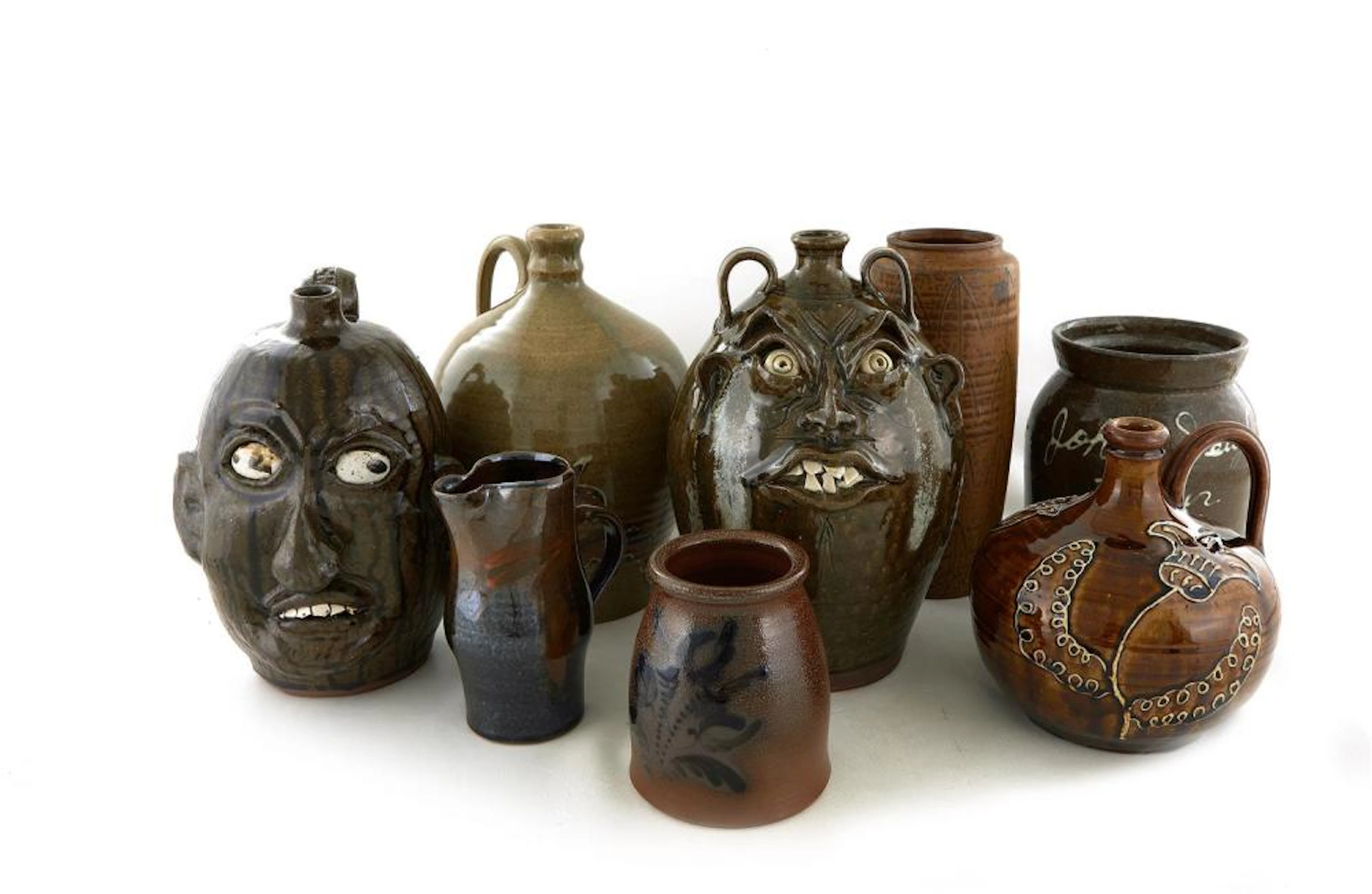 Southern Decorated Stoneware Jugs and Face Jugs, Signed (8pcs)