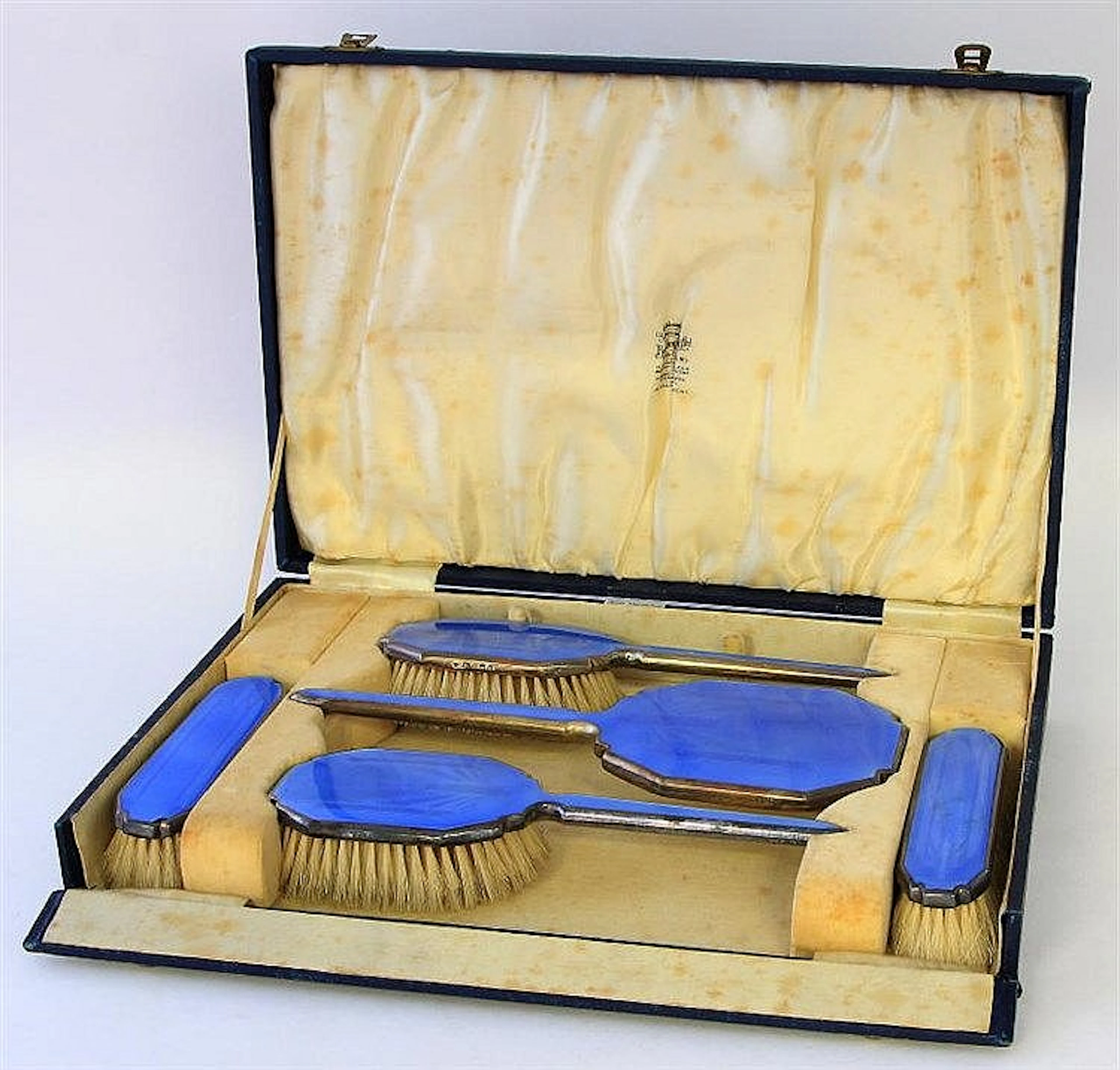 An Art Deco silver and enamel dressing table set D