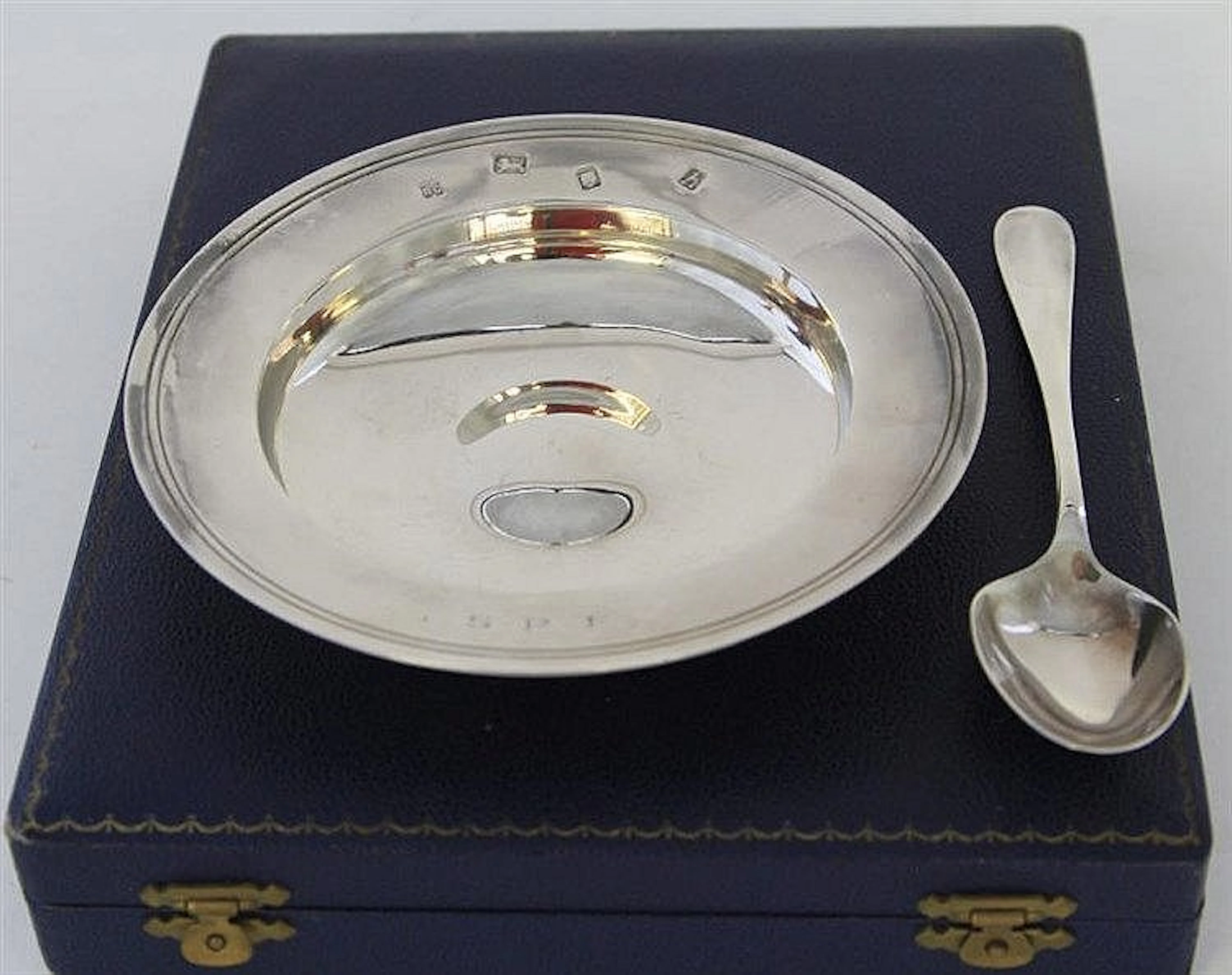A modern armada dish and spoon set Of conventional
