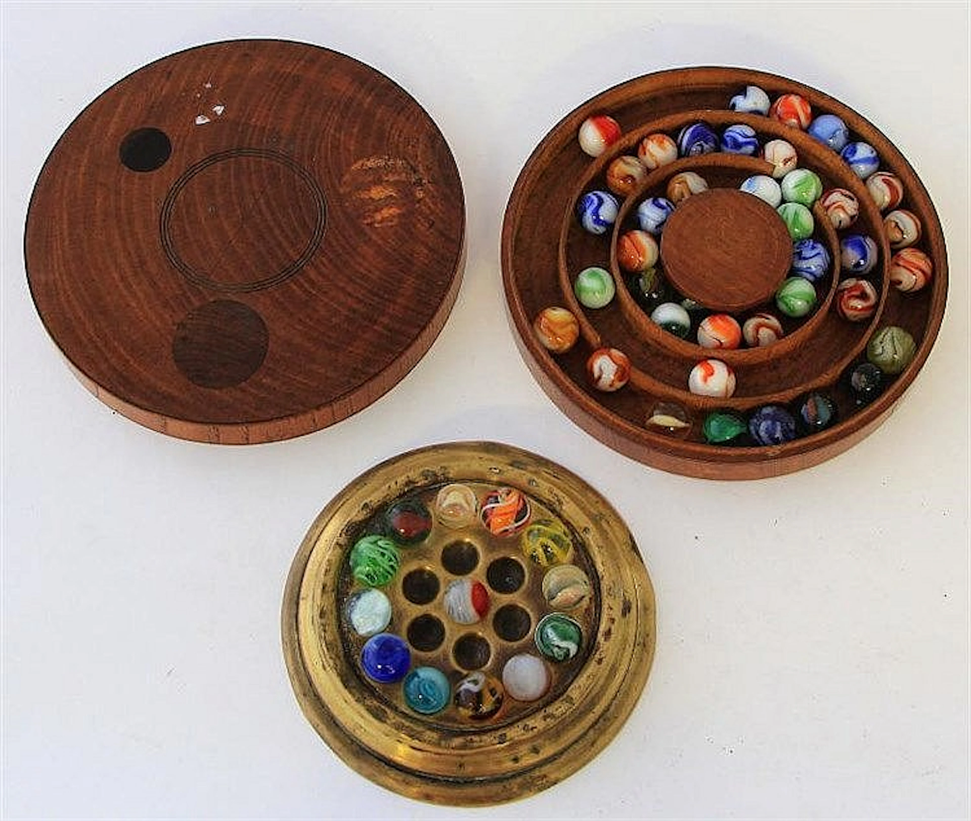 An early 20th century light oak circular game box
