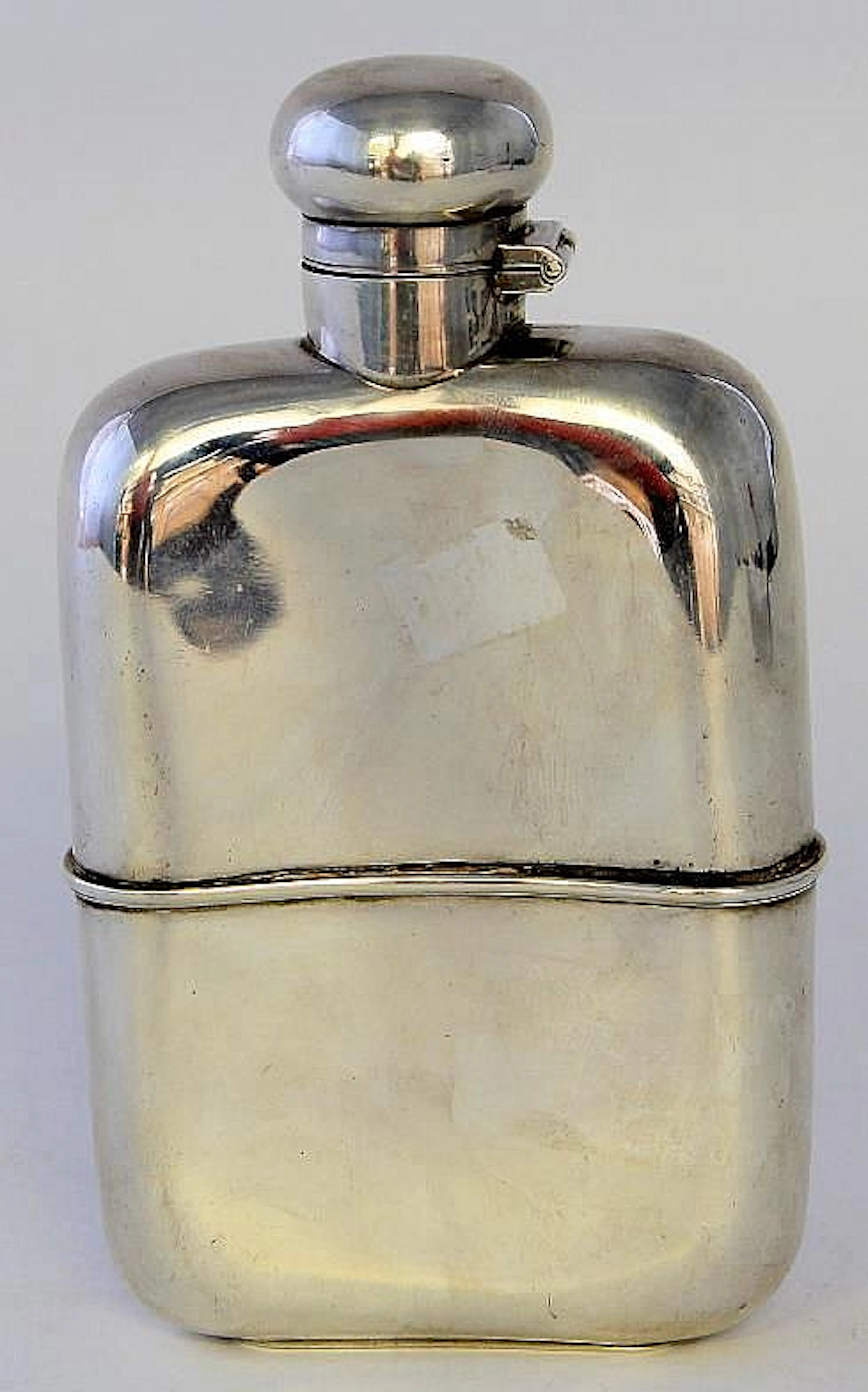 An Edwardian silver hipflask Of conventional form