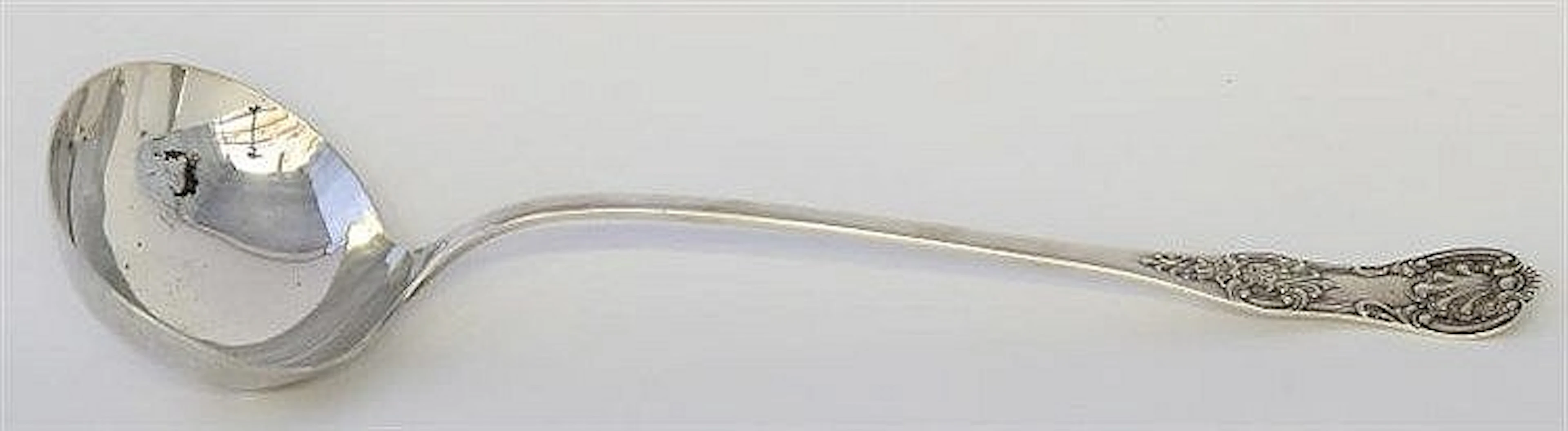 An Edwardian silver Kings Pattern ladle Pattern to