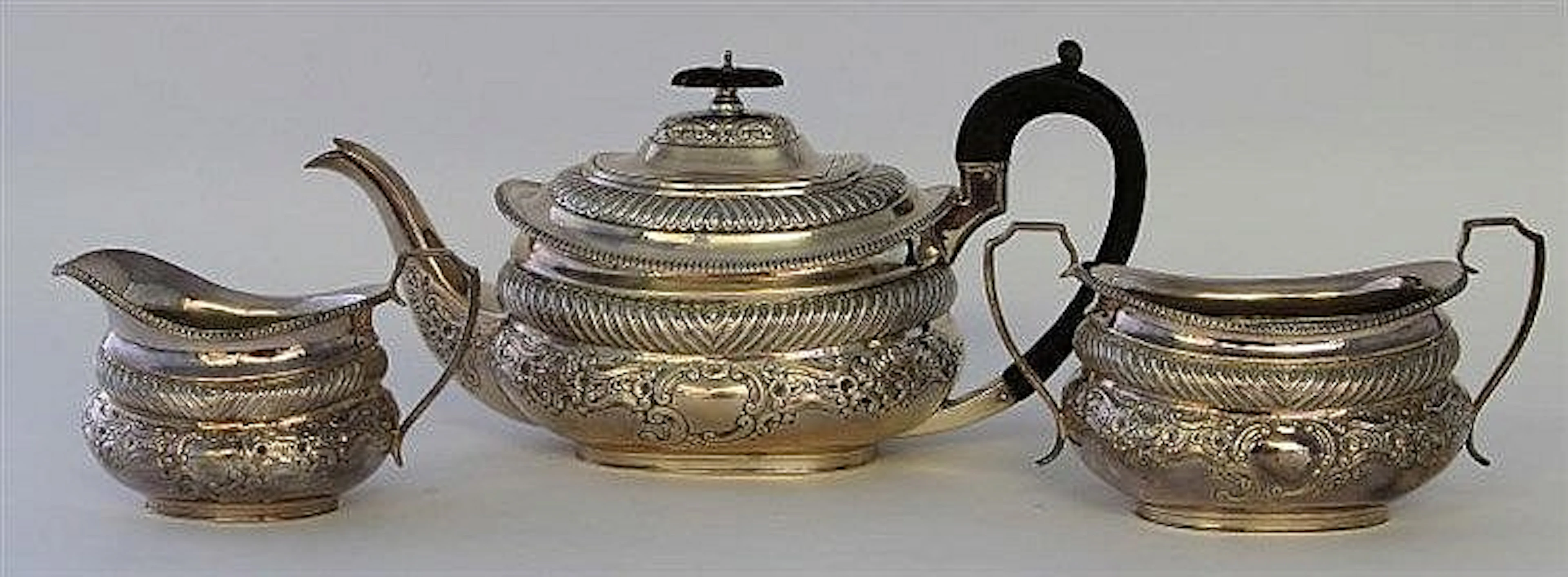 An Edwardian silver three piece tea service Of ovo