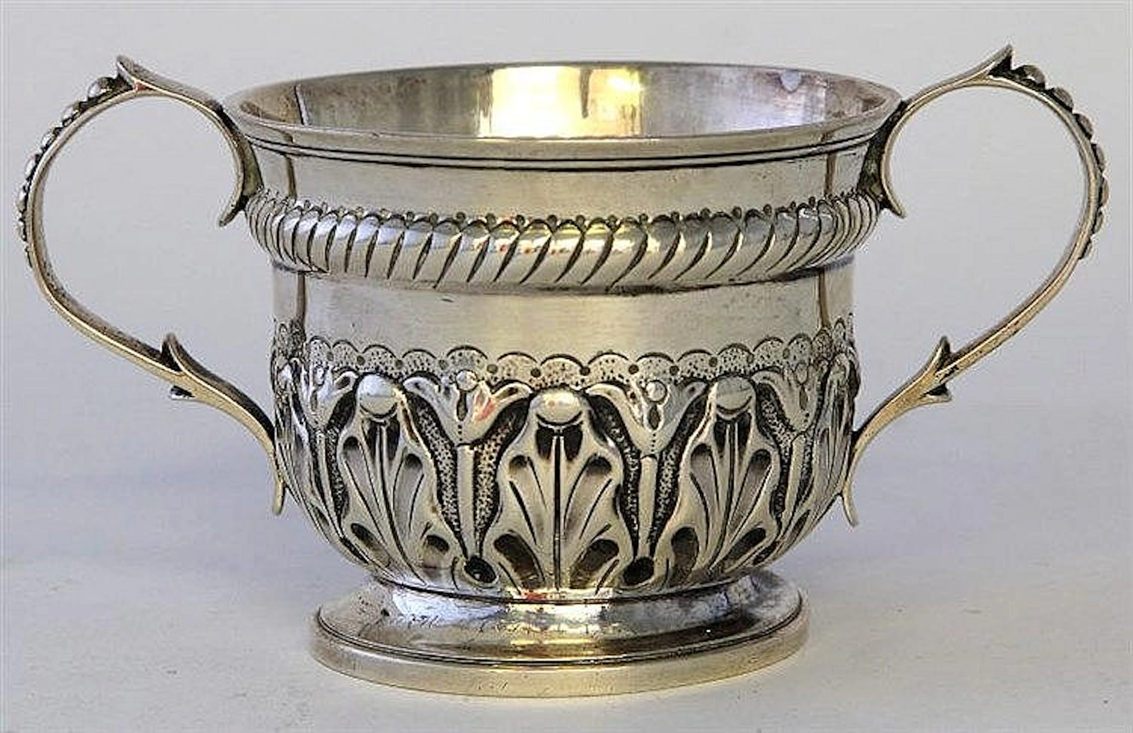 An Art Nouveau silver loving cup Embossed with sty