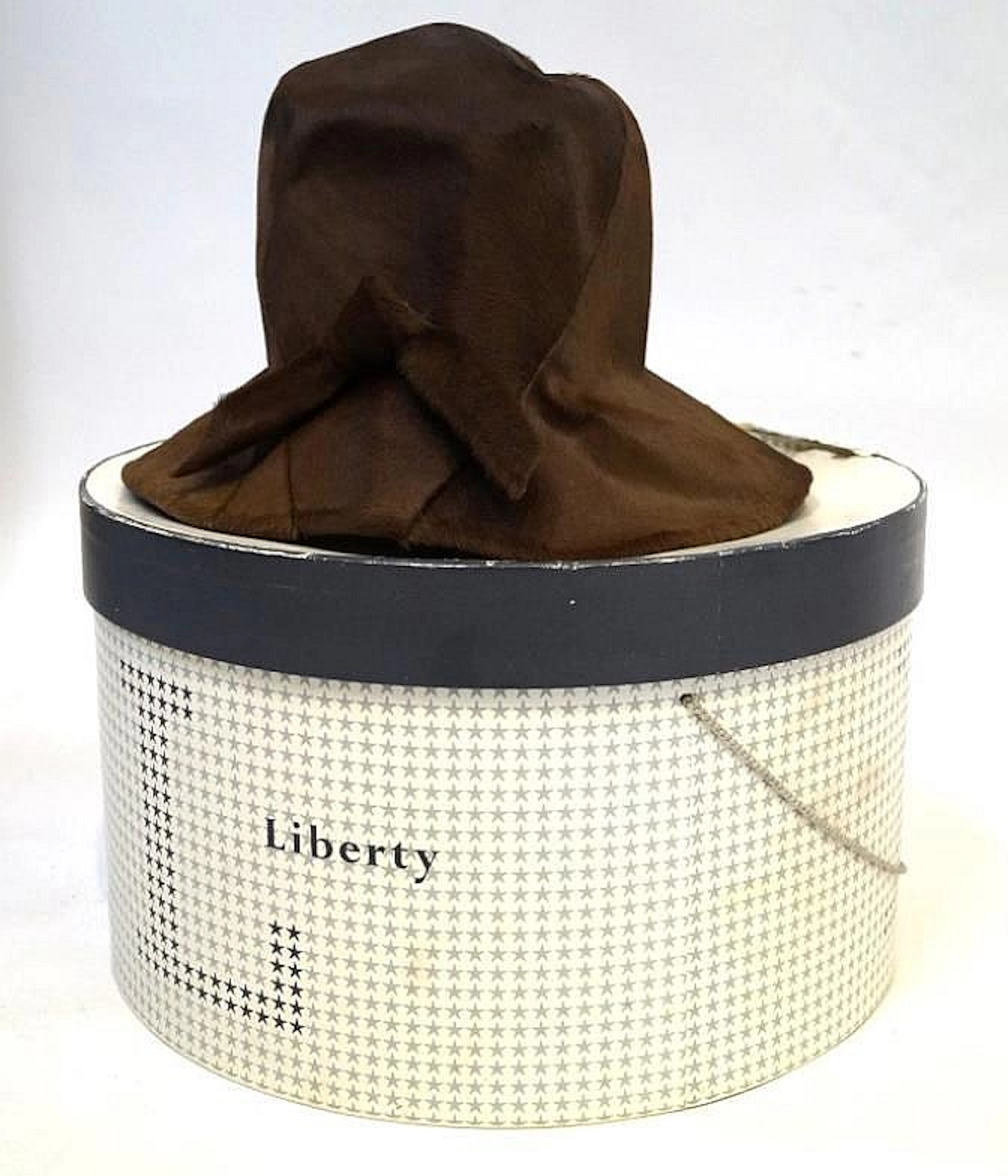 A Liberty of London ladies pony skin cloche hat Of typical form with white