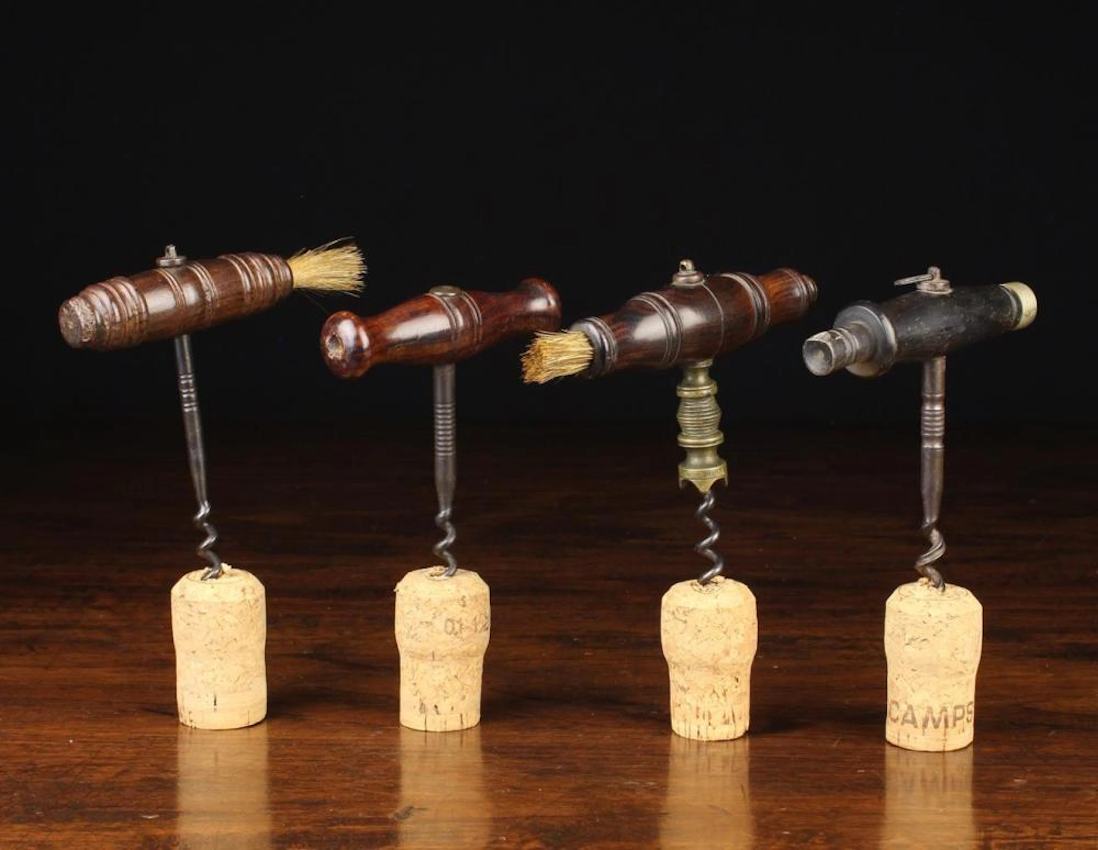 Four 19th Century Straight-pull Corkscrews with turned...