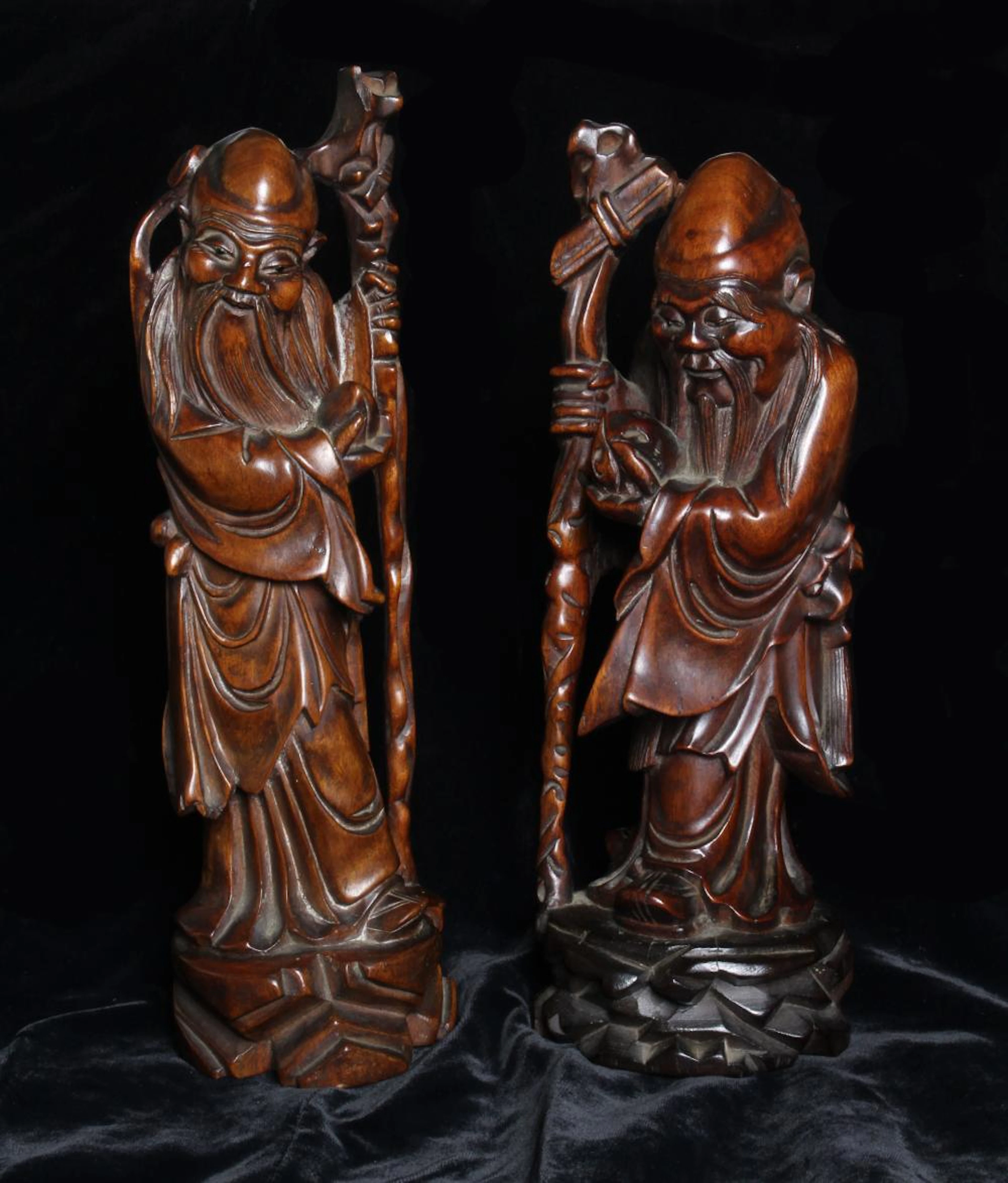 A Pair of Antique Oriental Hardwood Carvings of the Shou...