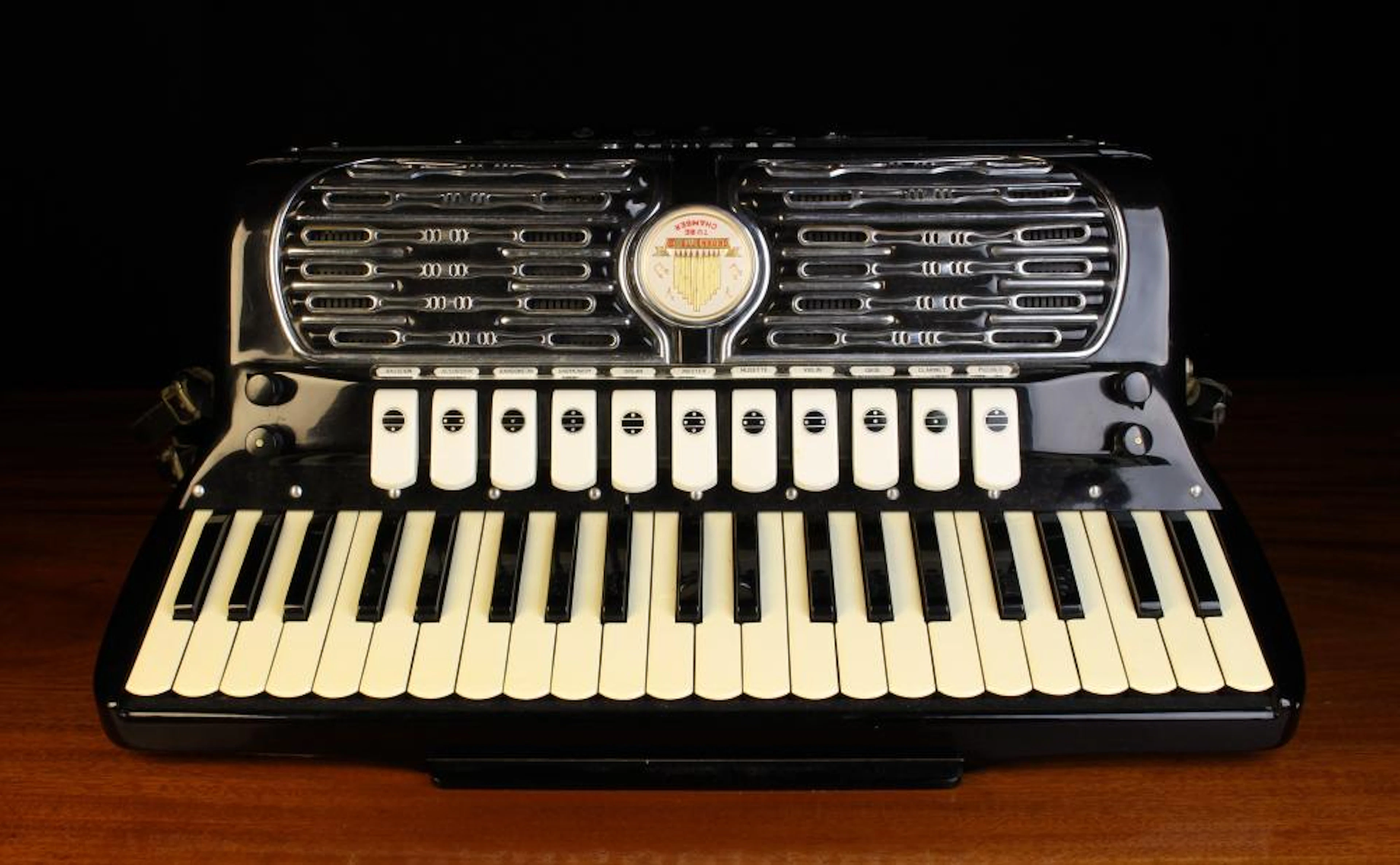 A Fine Italian Made Black Lacquered Patent Titano Accordian