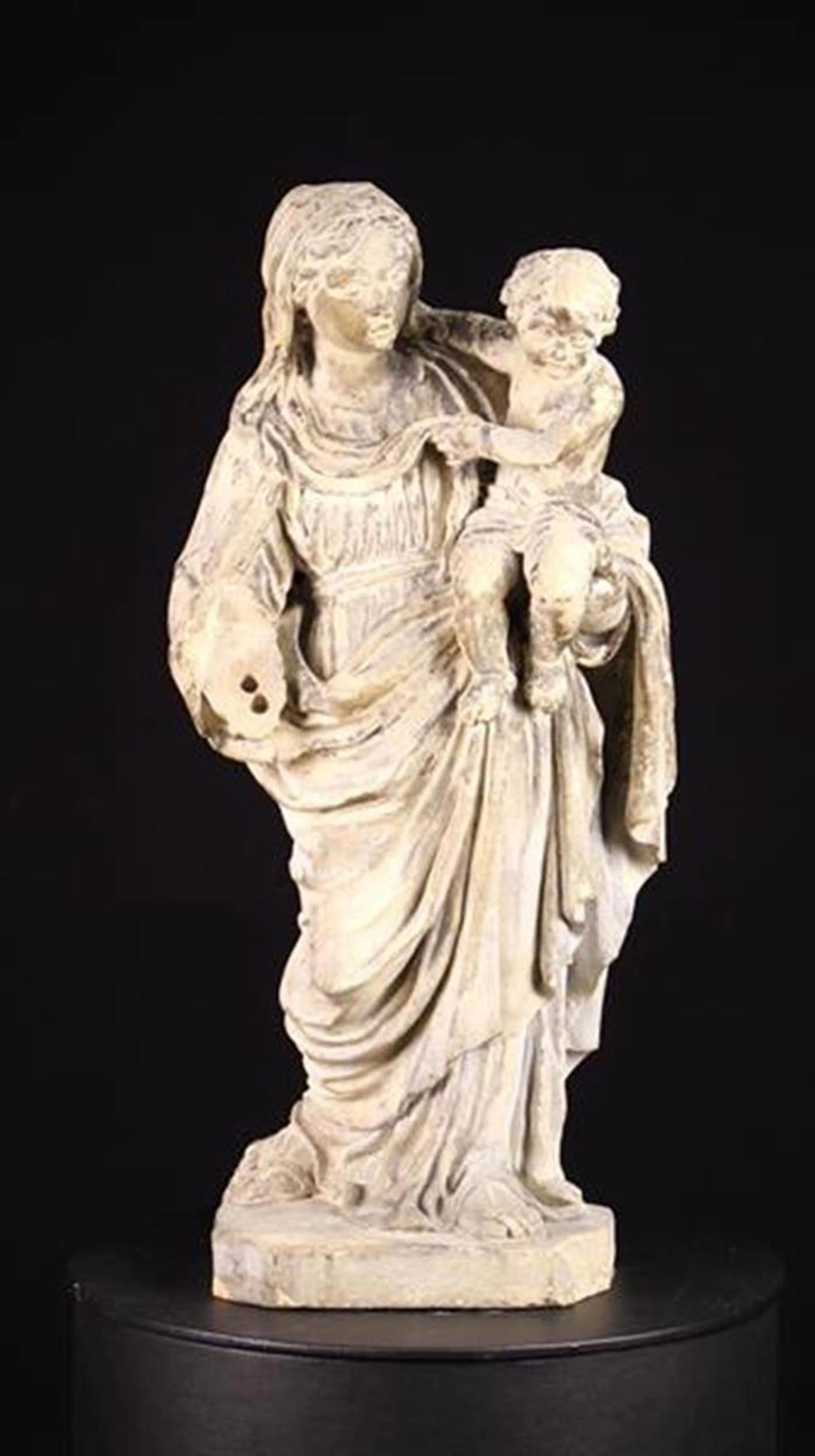 A 17th Century Limestone Carving of The Virgin & Child