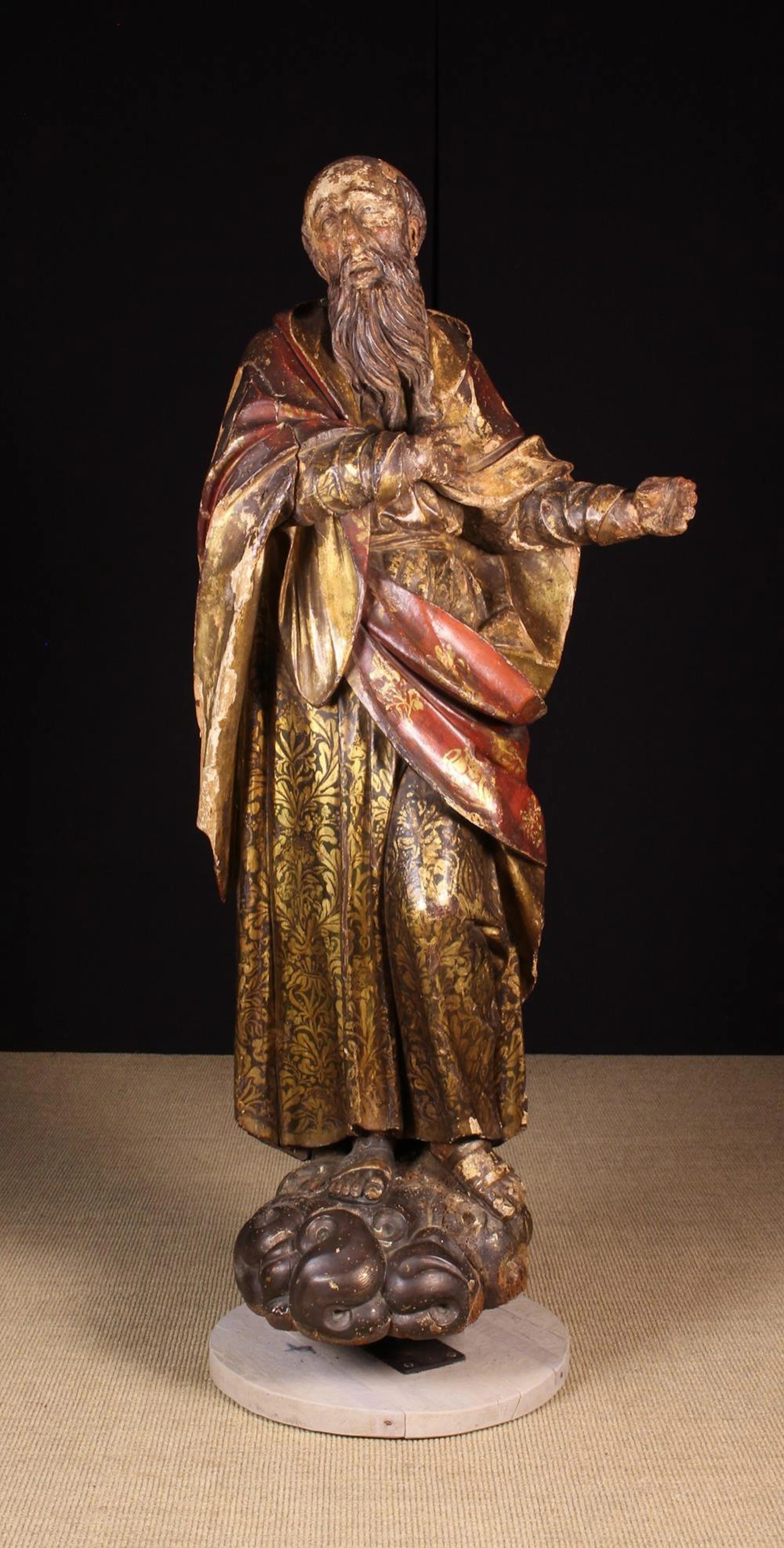 A 16th Century Polychromed Walnut Near life-sized Sculpture of Saint Jerome