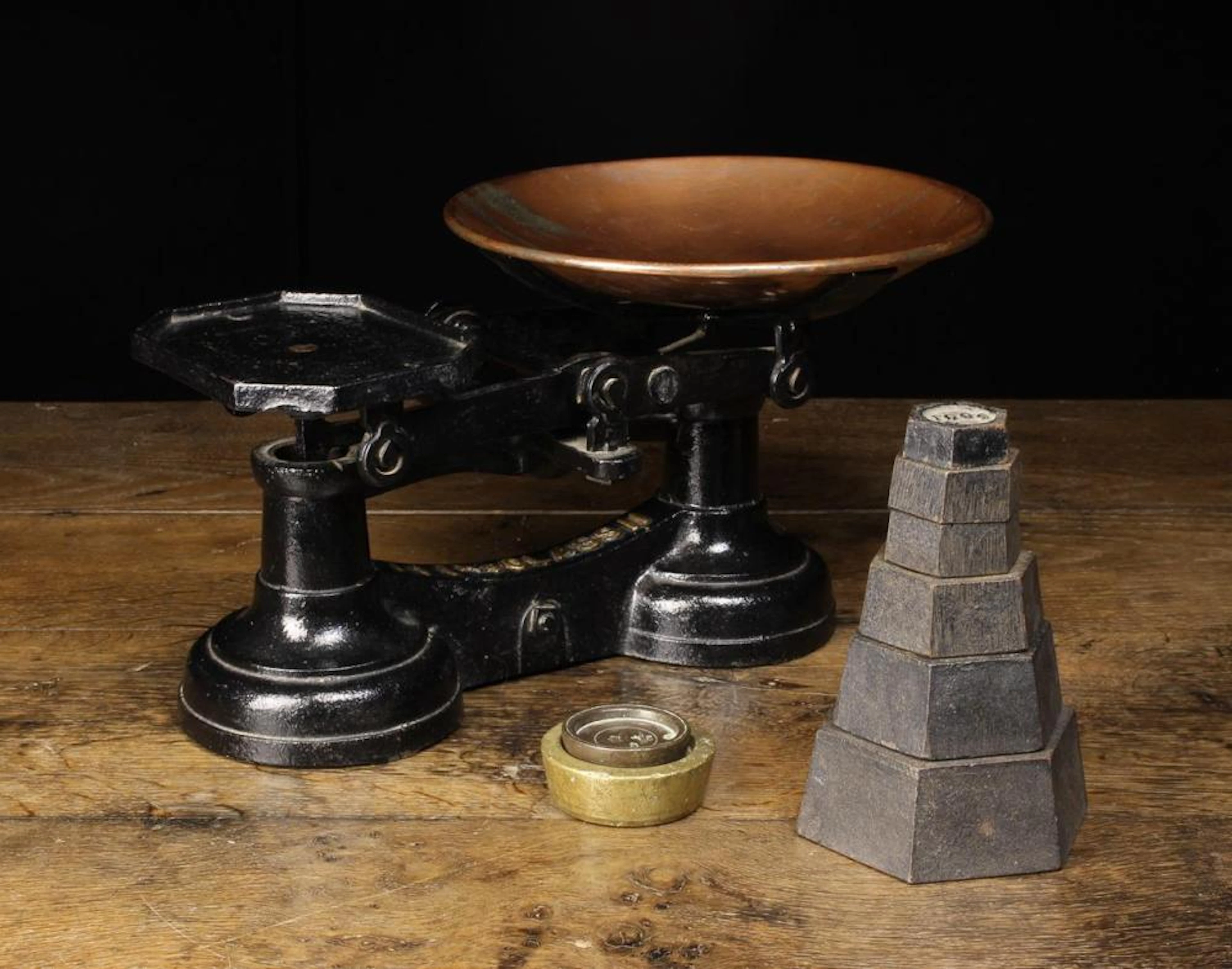 A Set of Vintage Cast Iron Kitchen Weighing Scales