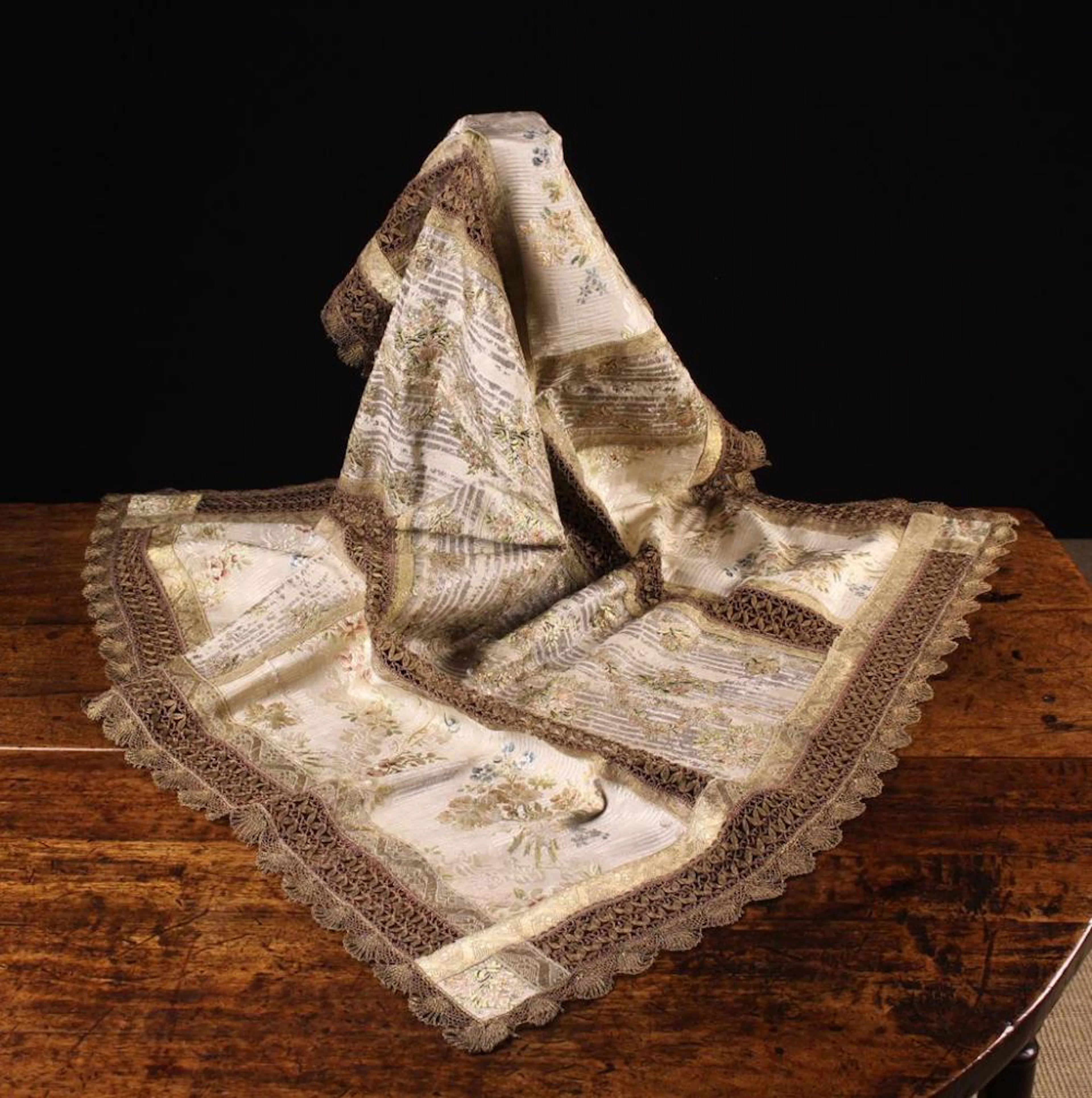 An Antique Brocade Altar Cloth composed of ivory silk...