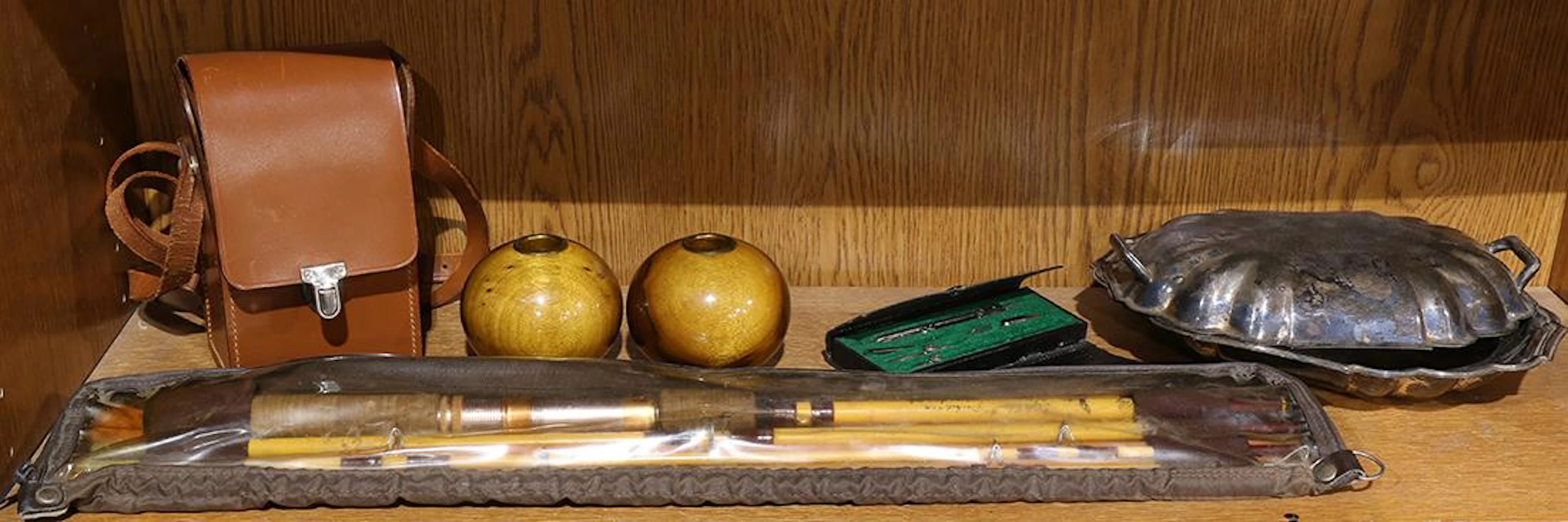 One shelf of miscellaneous decoratives, including a