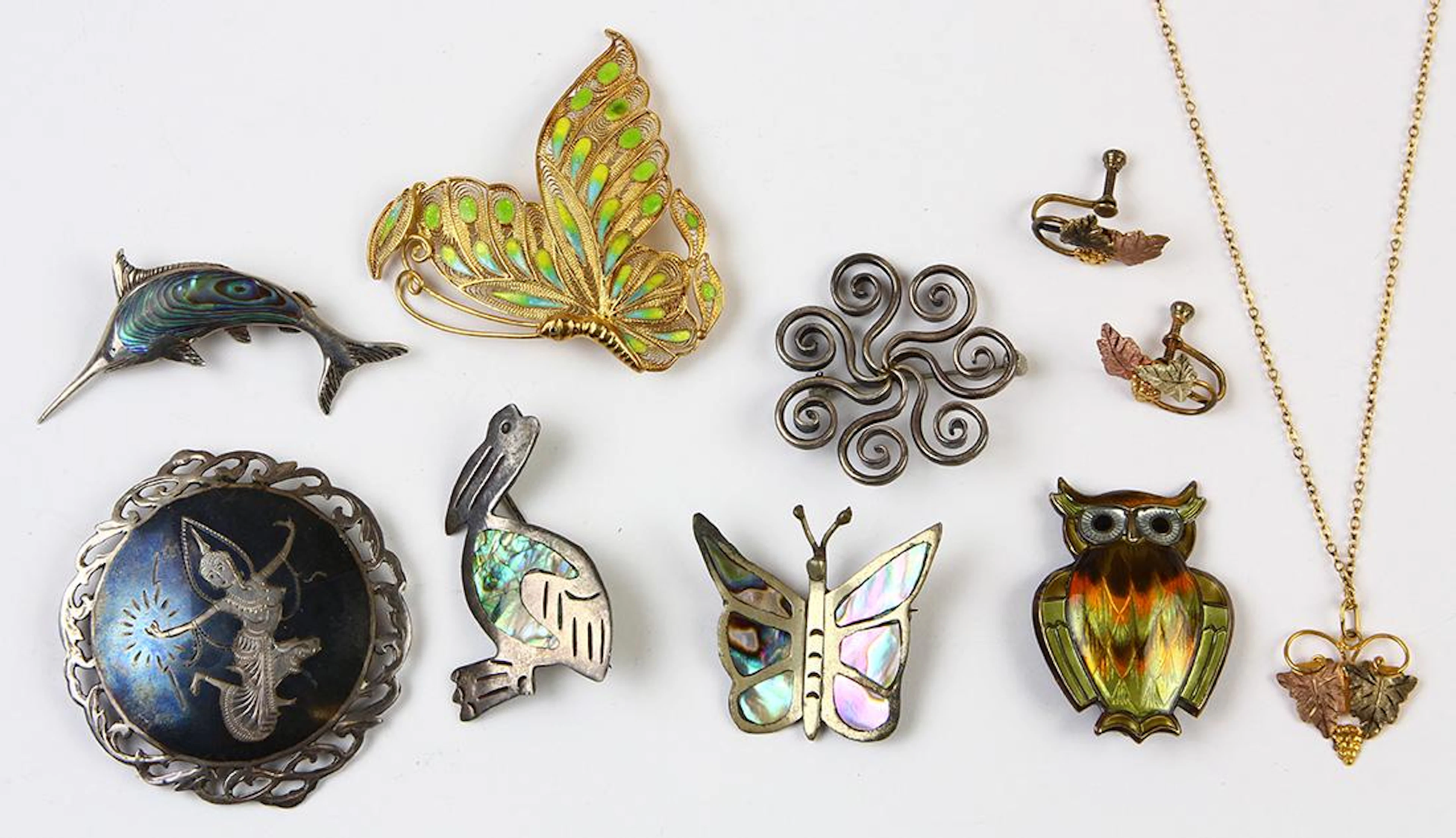 (Lot of 9) Abalone, gold, sterling silver and