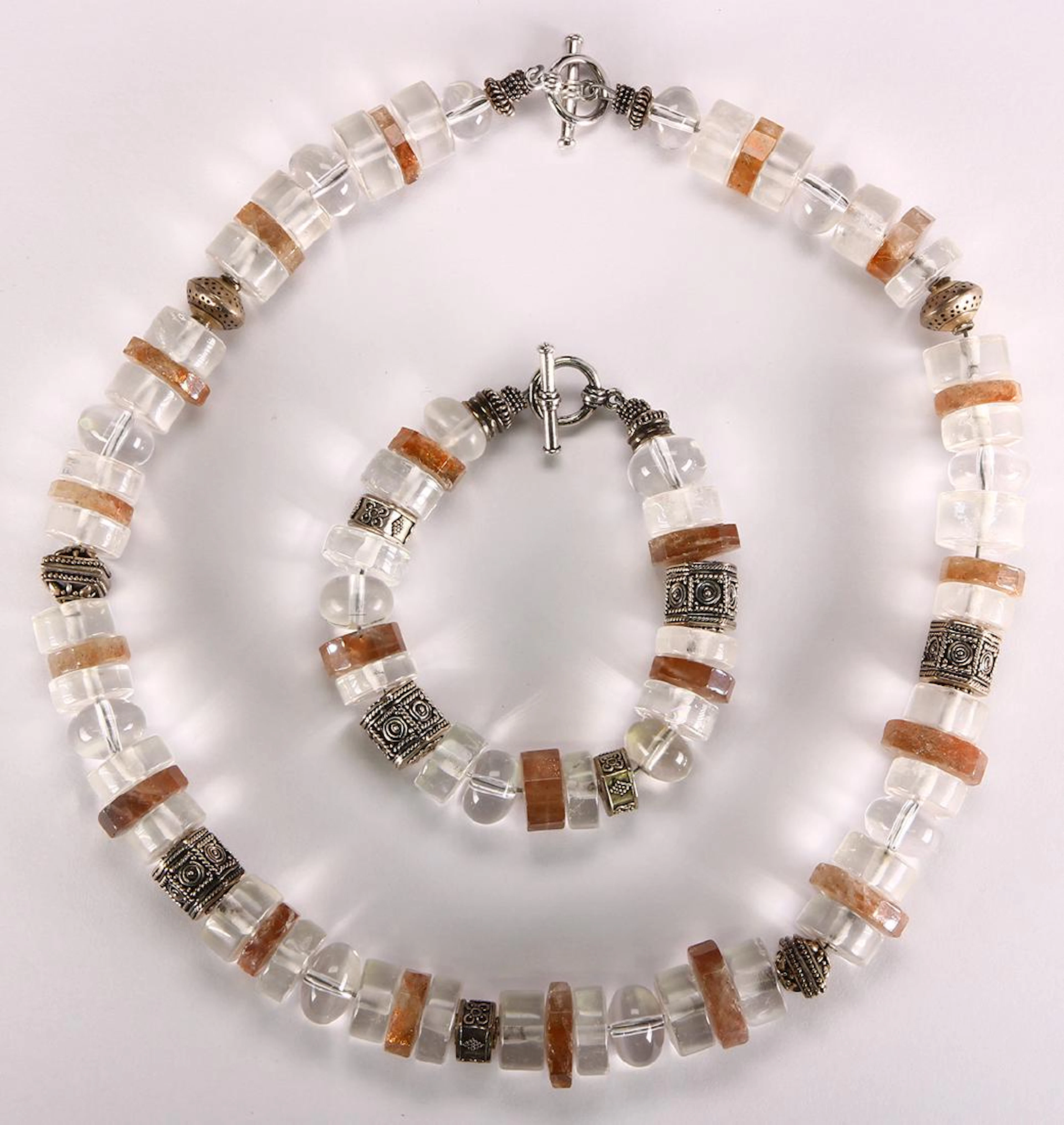 Rock crystal quartz, sunstone, silver and metal jewelry