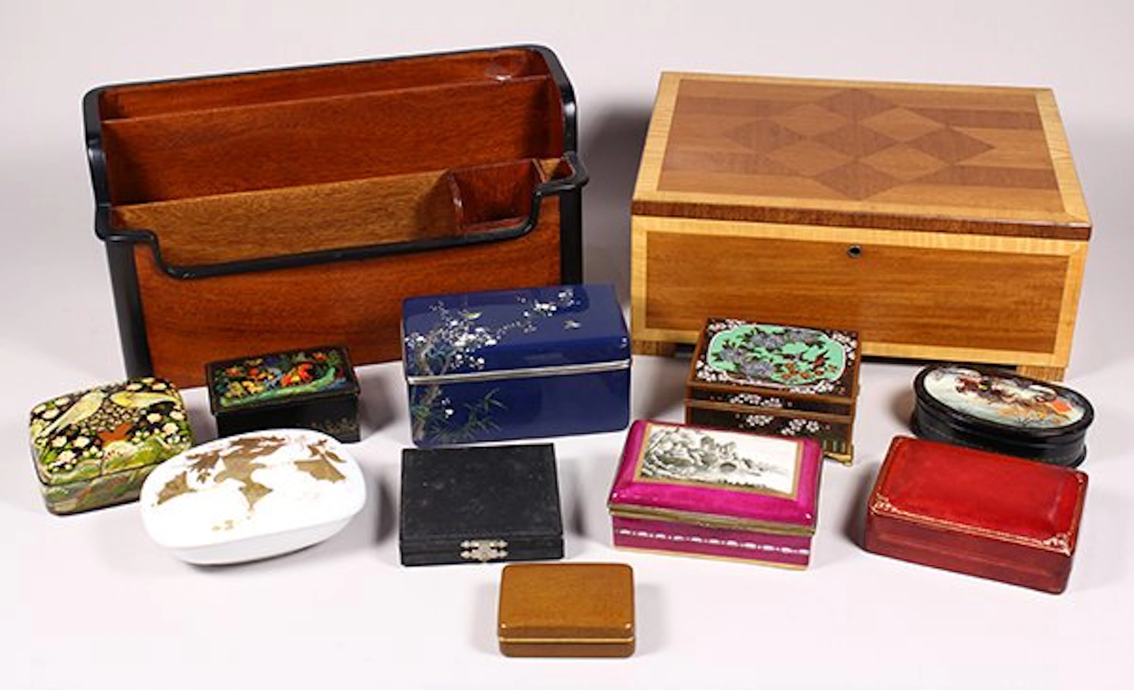 Two shelves of boxes, including Russian lacquered