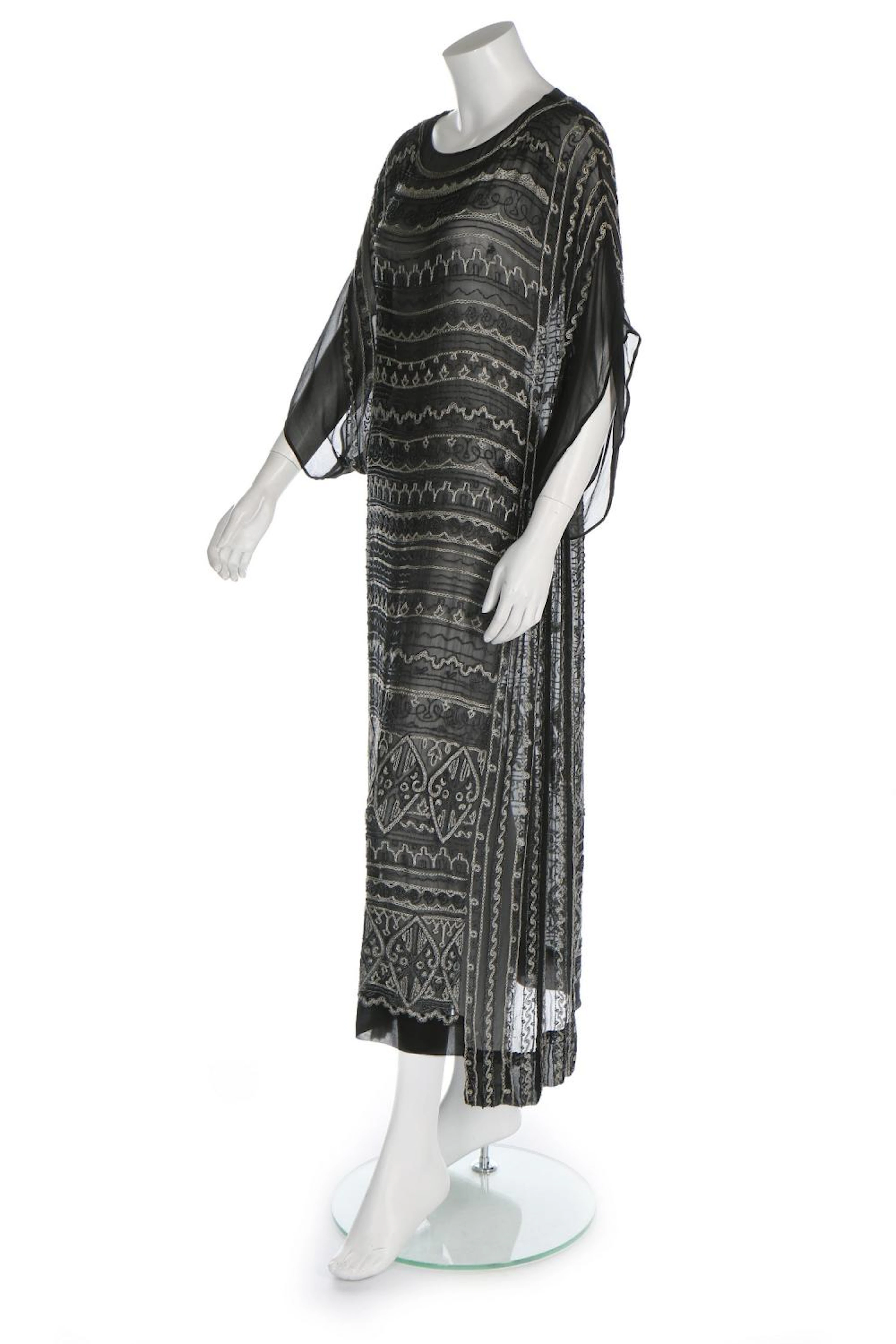 An embroidered georgette evening gown, circa 1922, possibly by Chanel, the
