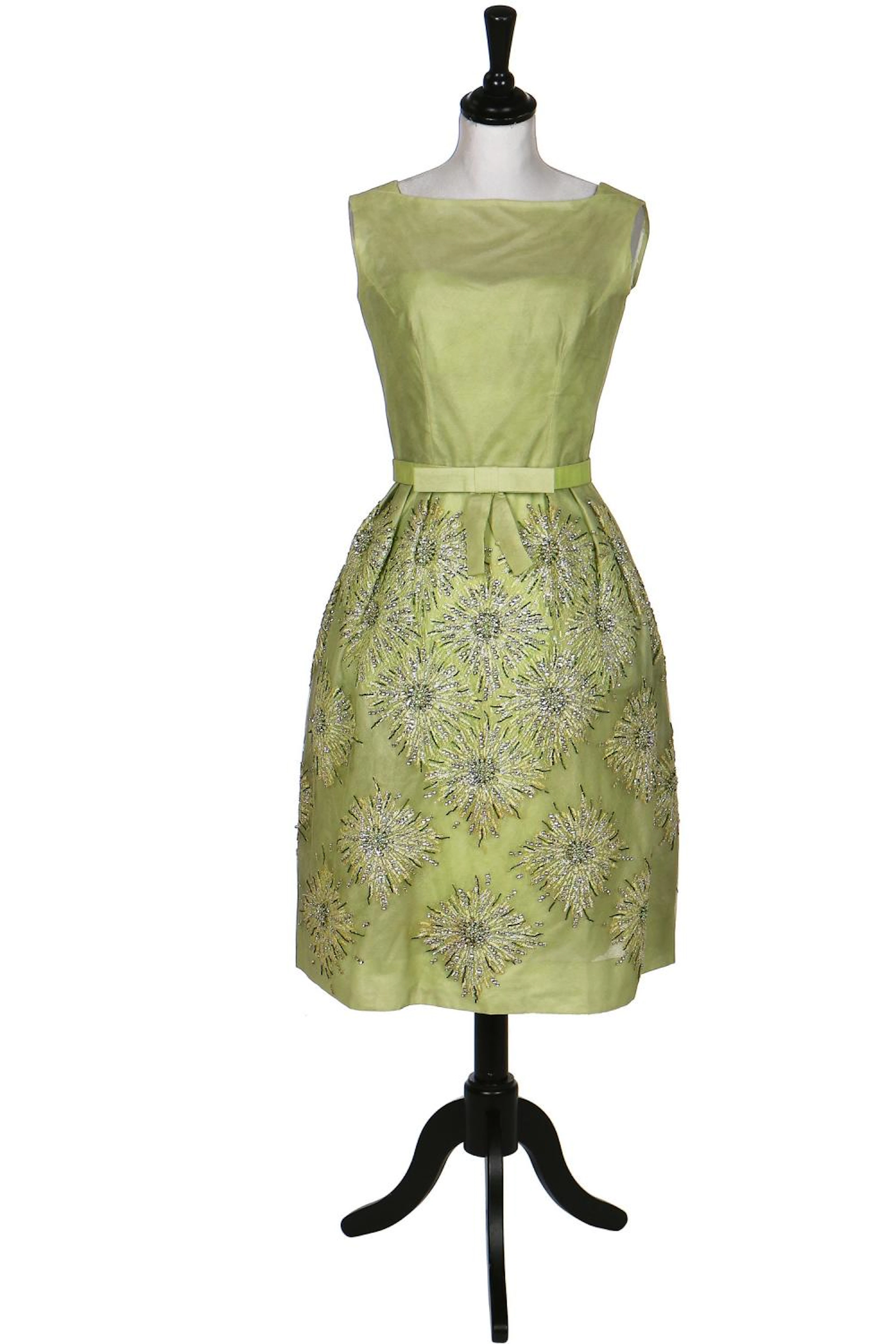A Norman Hartnell couture pale green sequinned tulle cocktail dress, circa 1960,
