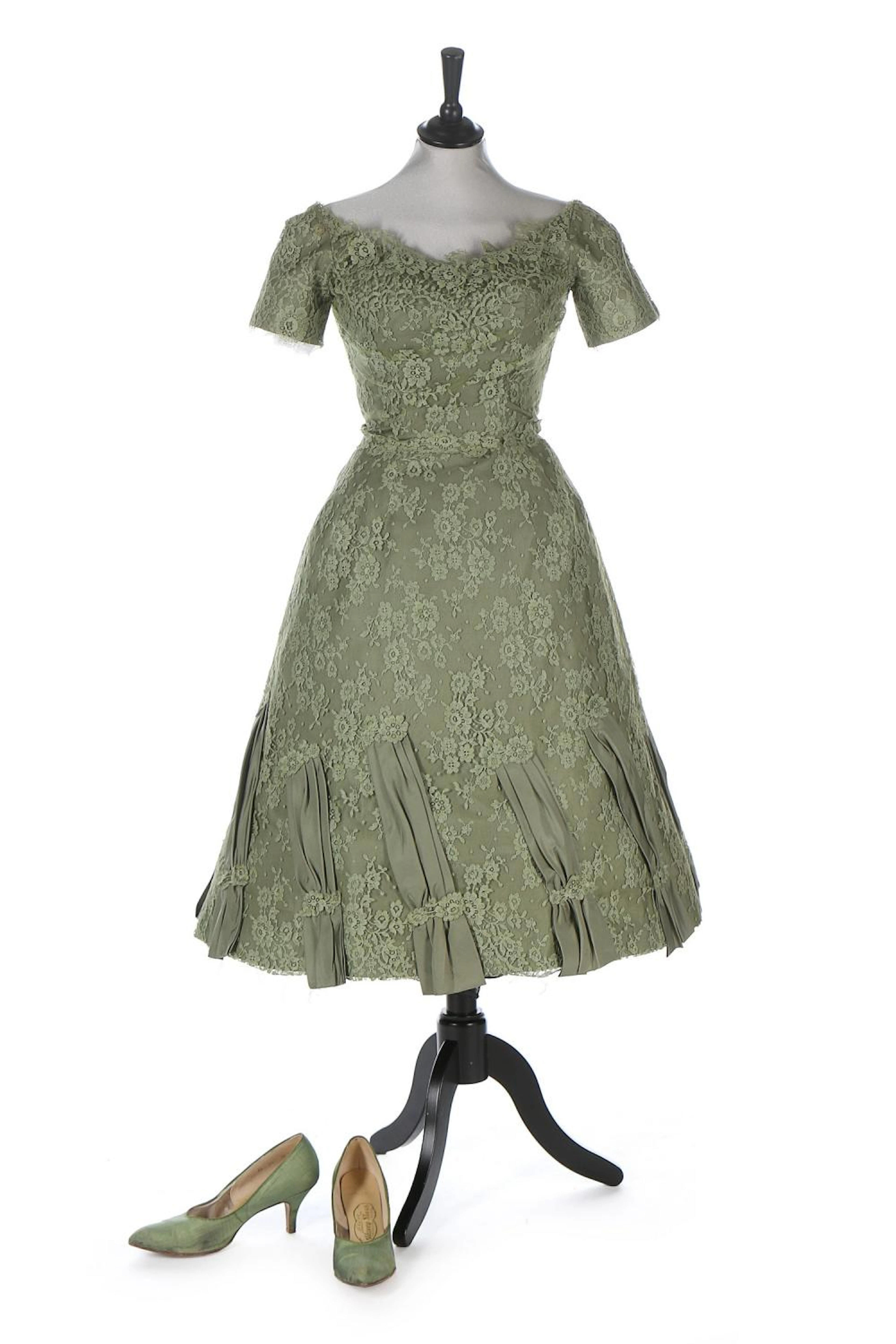 A Ceil Chapman sage-green lace dress, 1959, labelled, the skirt with taffet