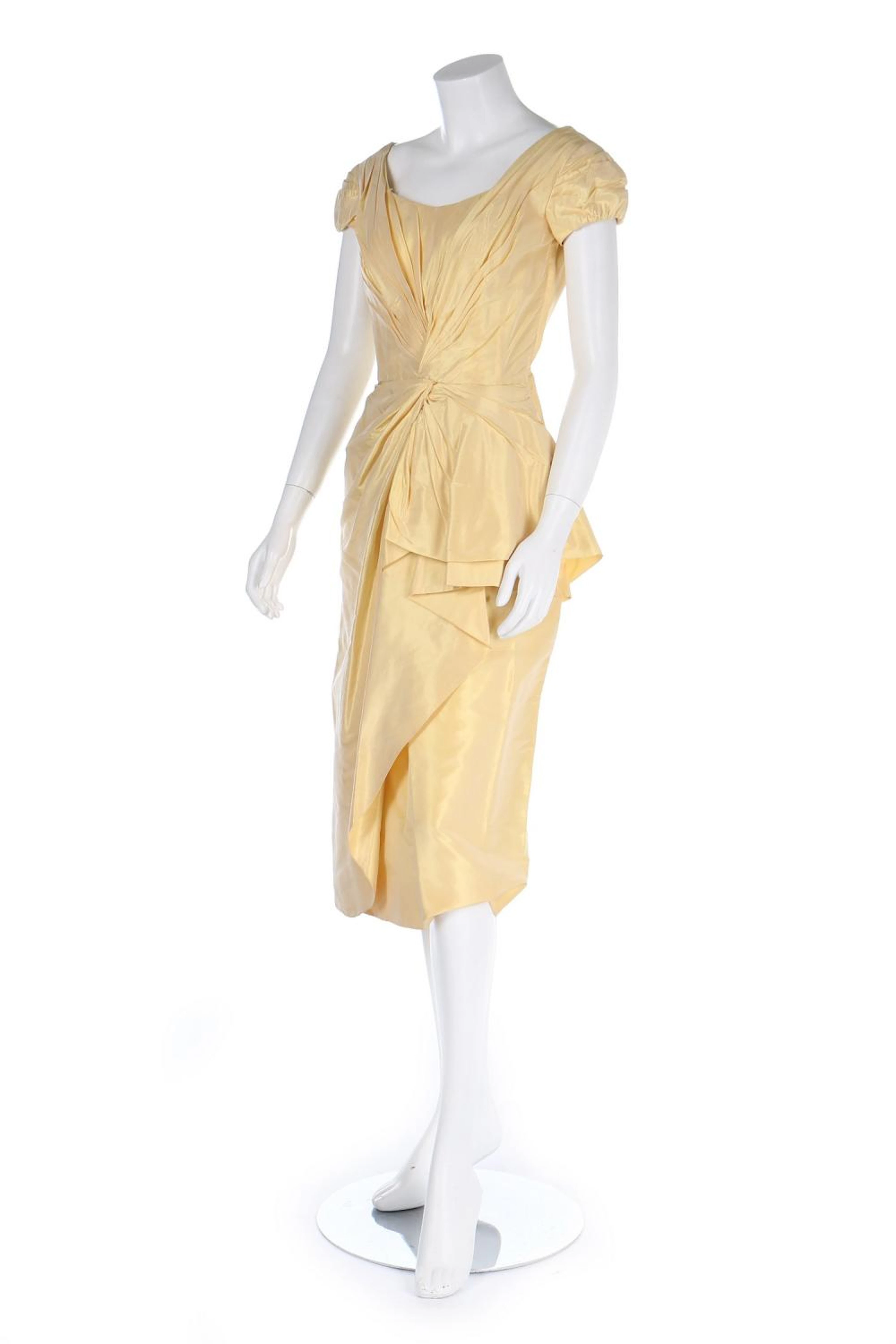 A Ceil Chapman primrose yellow taffeta cocktail gown, 1950s, with pleated h