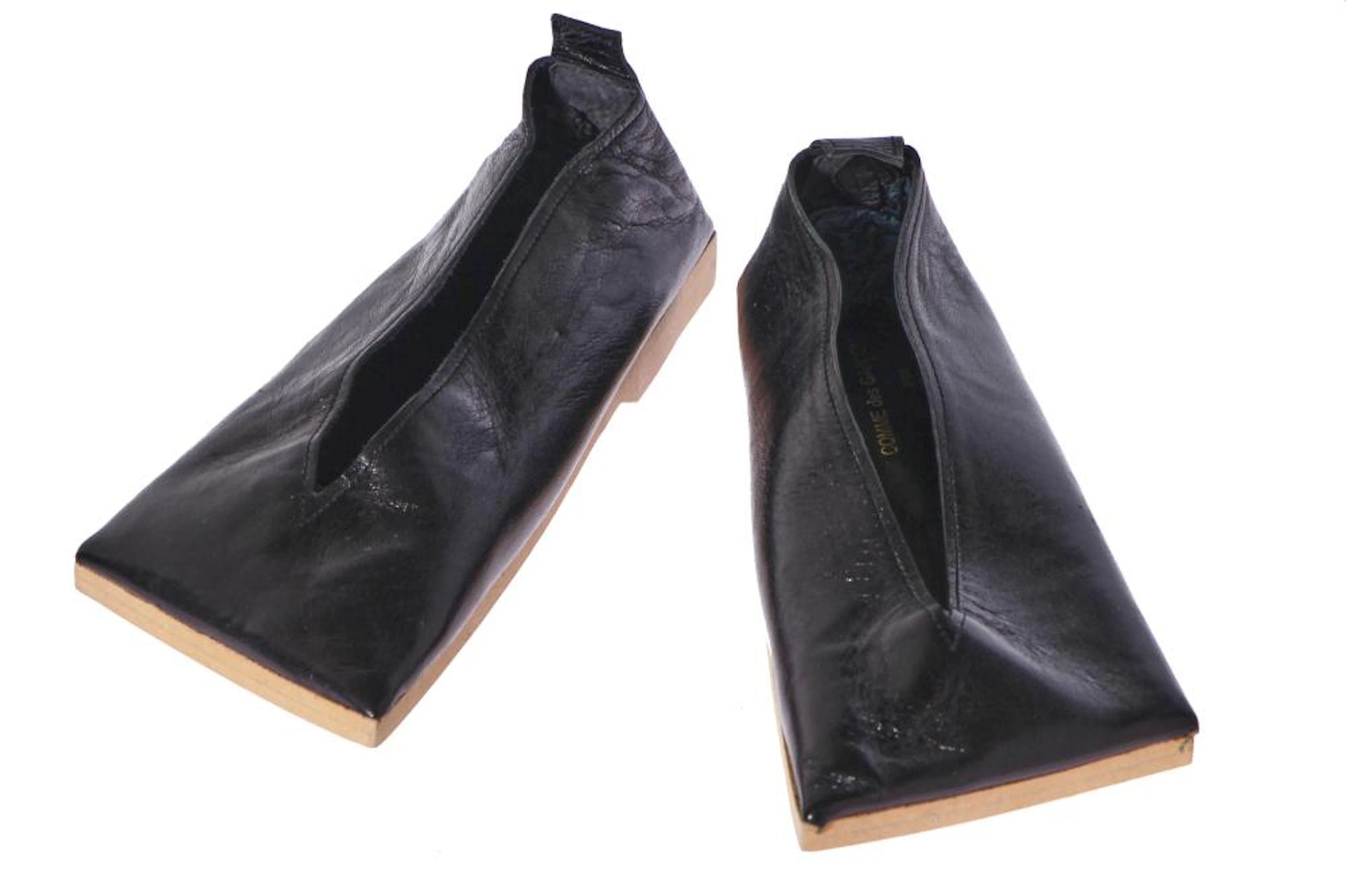 A pair of rare Comme des Garçons 'flat' black leather shoes, circa 1985